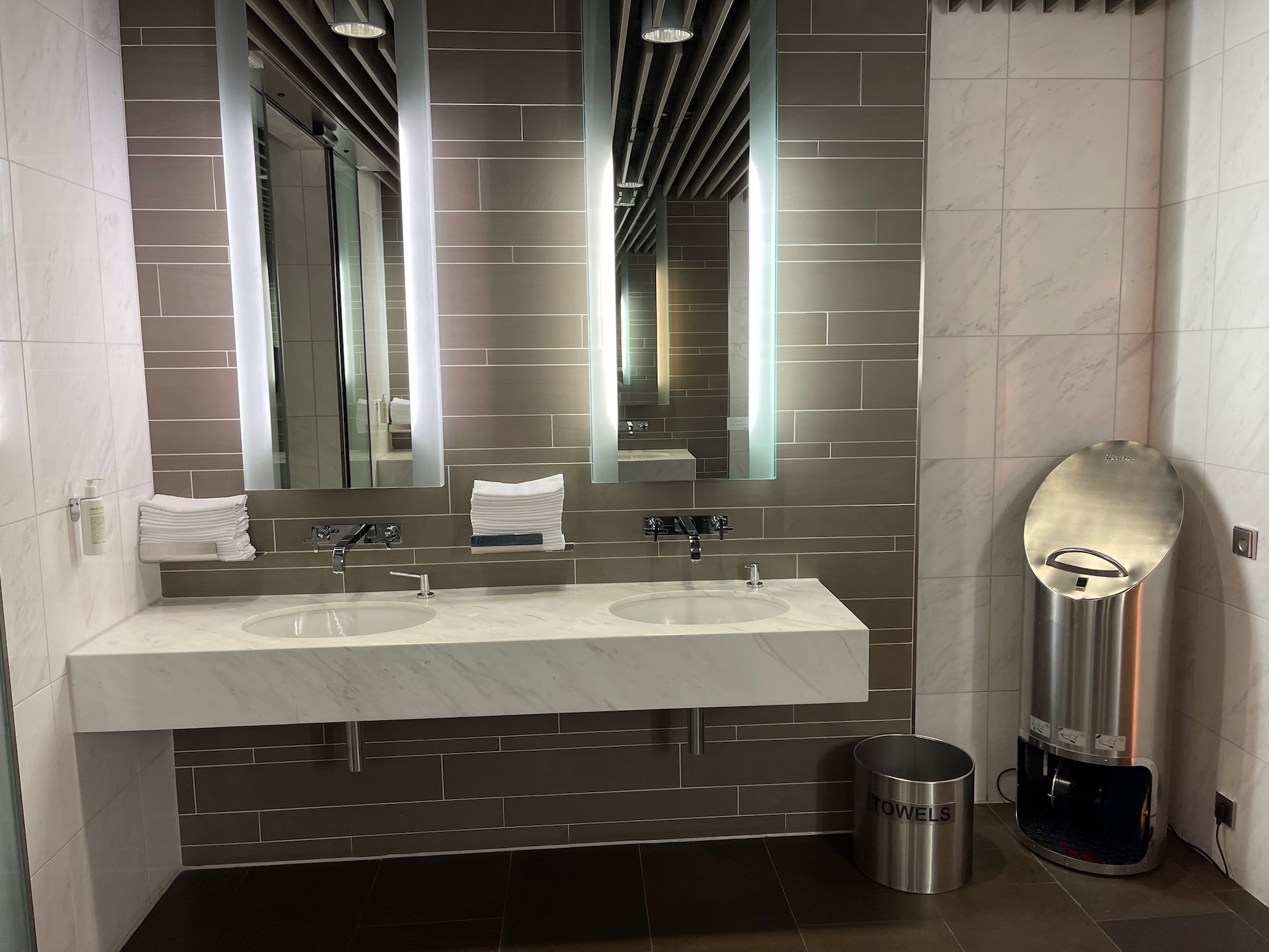 a bathroom with a mirror and sinks