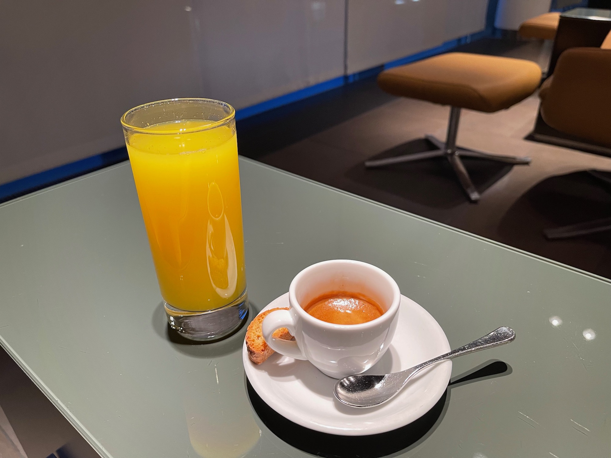 a cup of coffee and a glass of orange juice