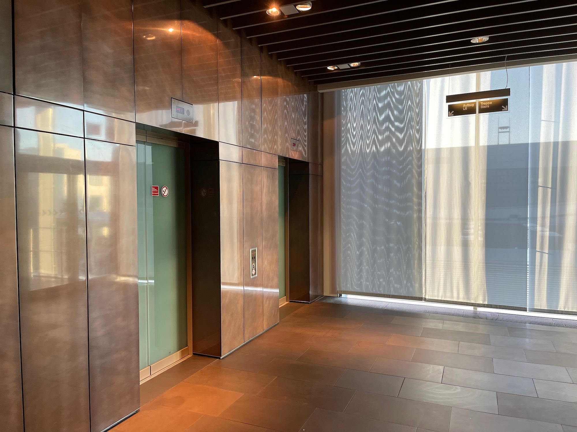 a elevator with glass doors and a large window