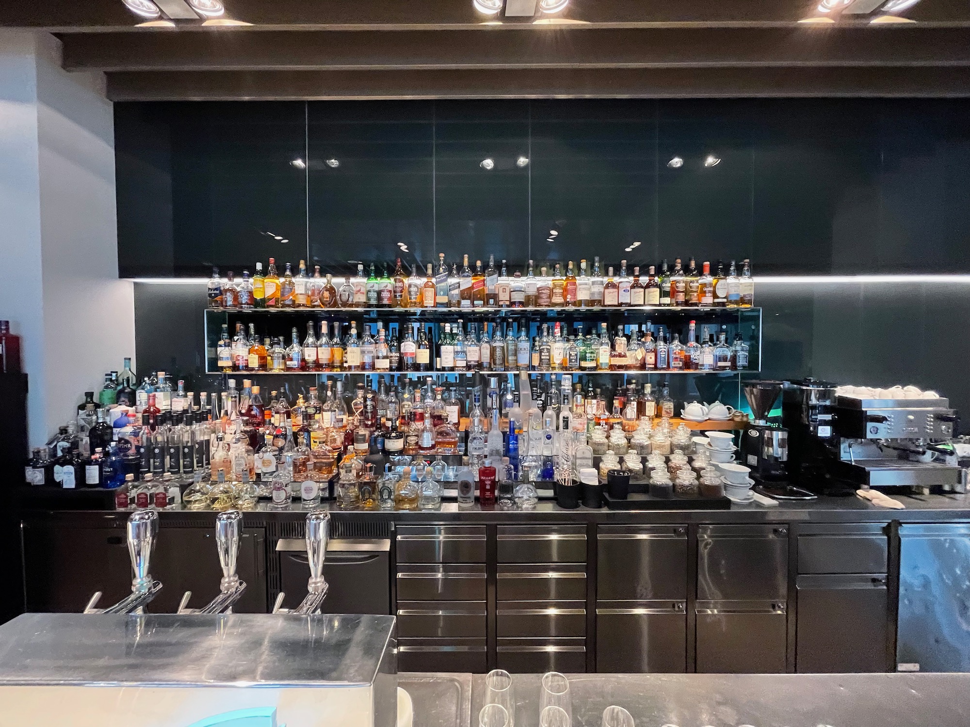 a bar with many bottles of alcohol