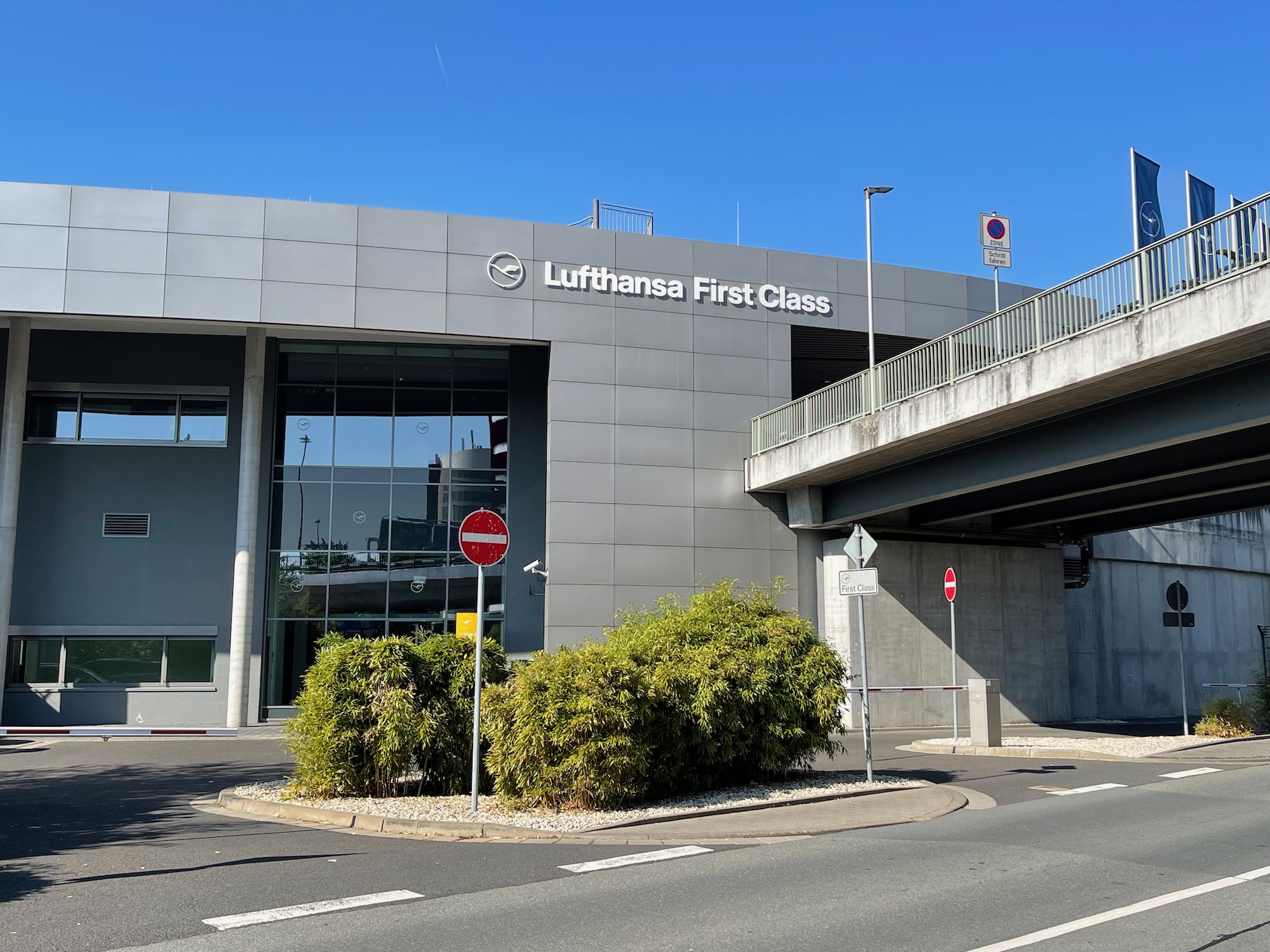 a building with a bridge and a sign