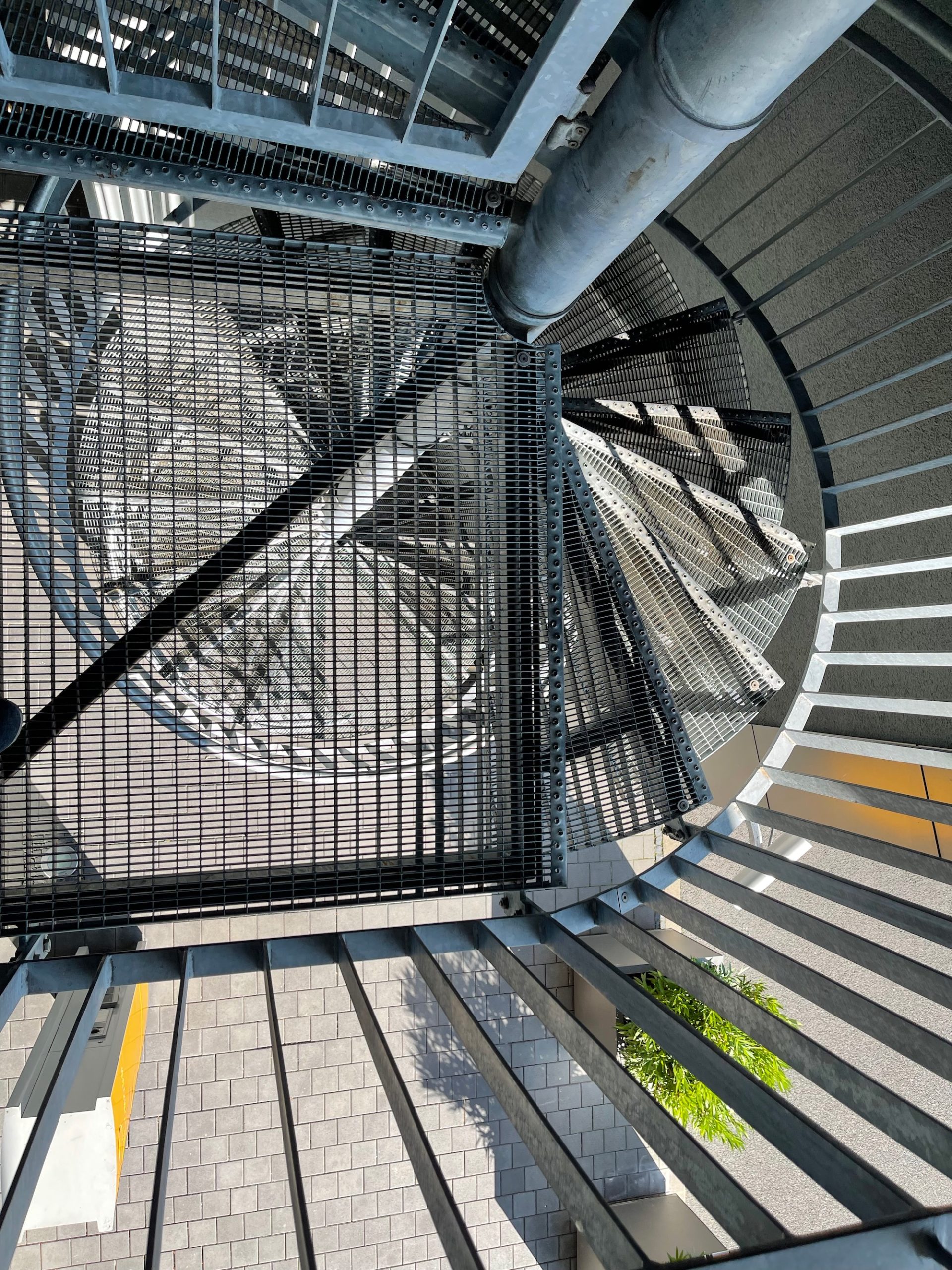 a spiral staircase with metal railings