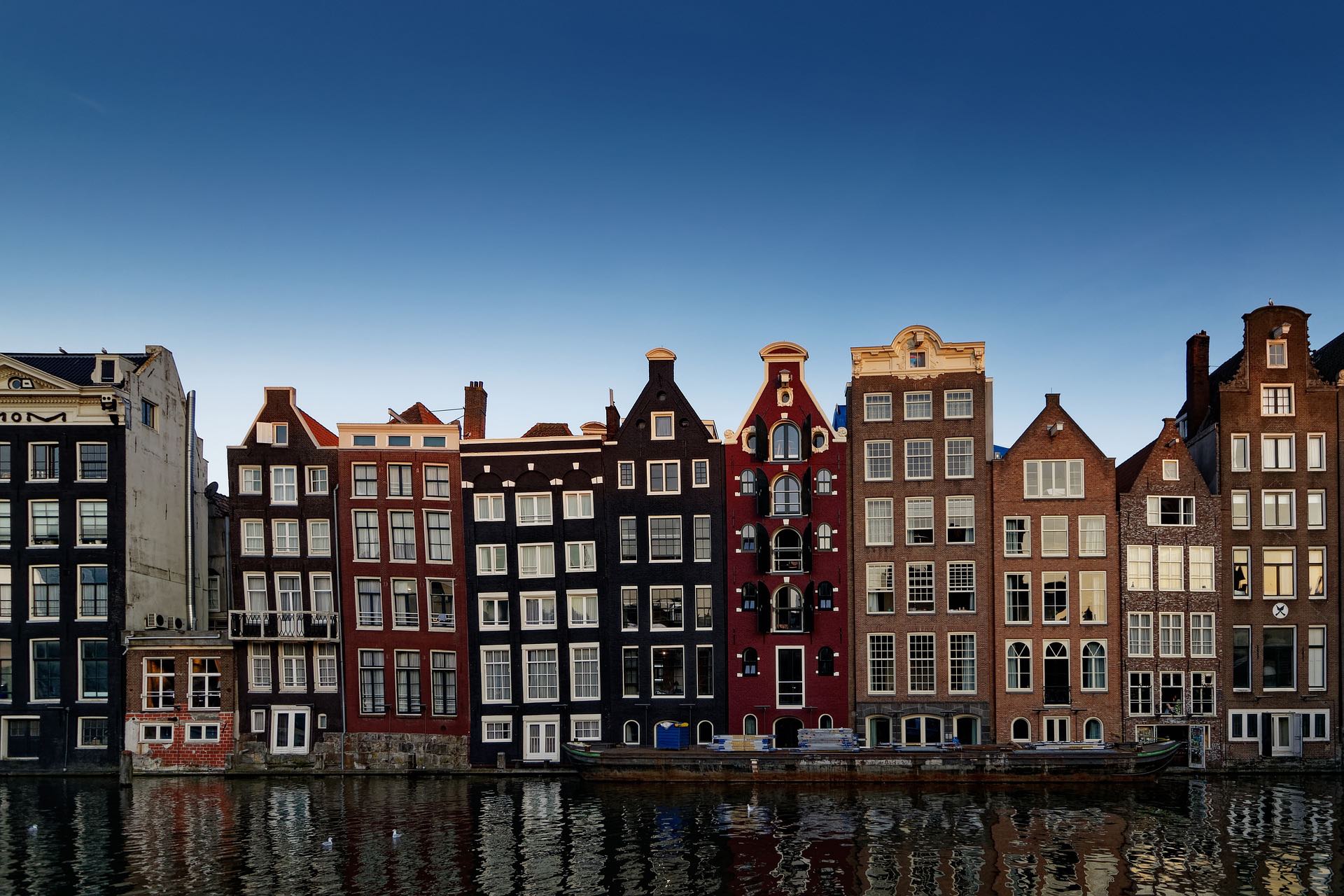 a row of buildings next to water