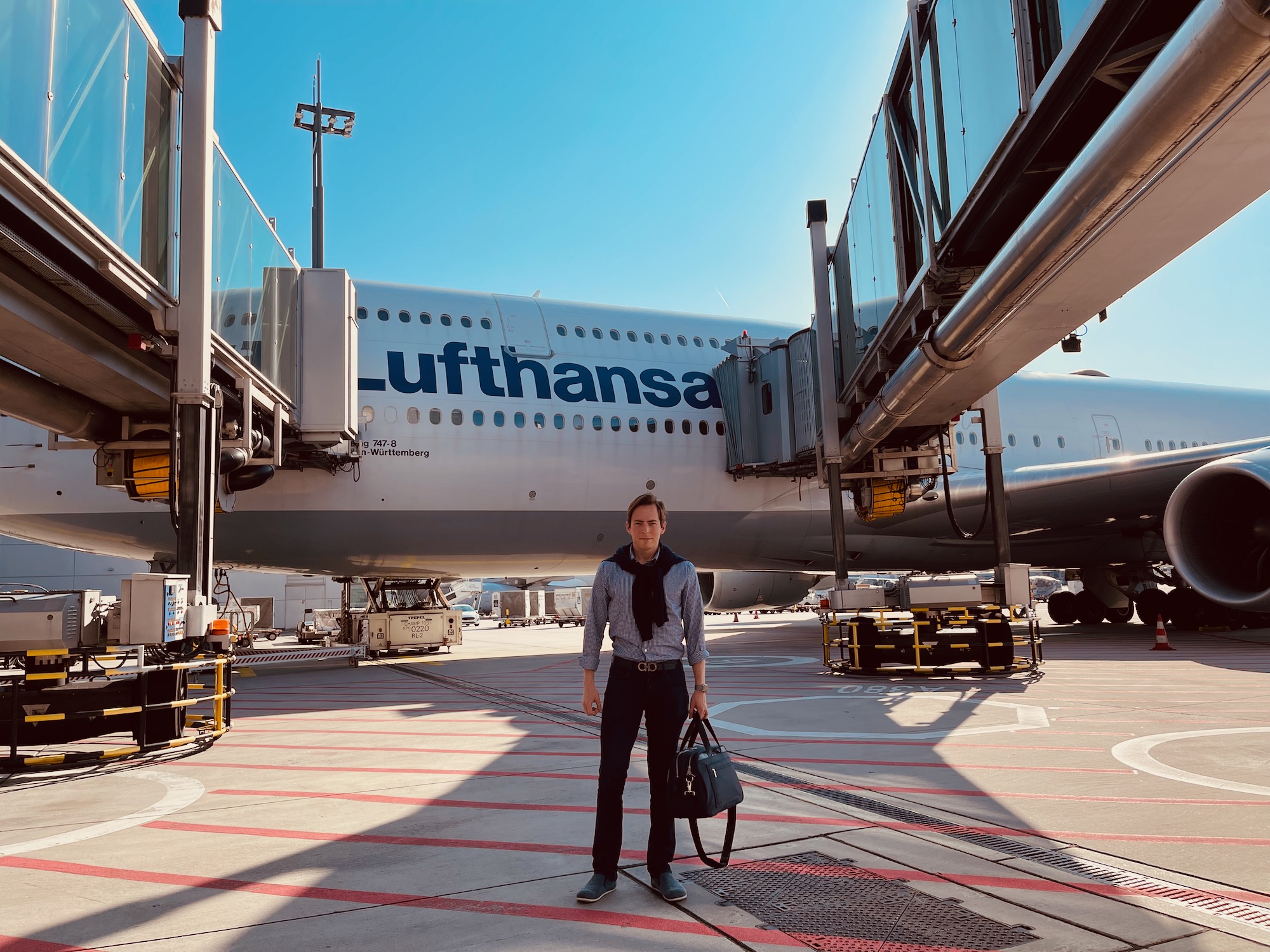 a man standing in front of an airplane