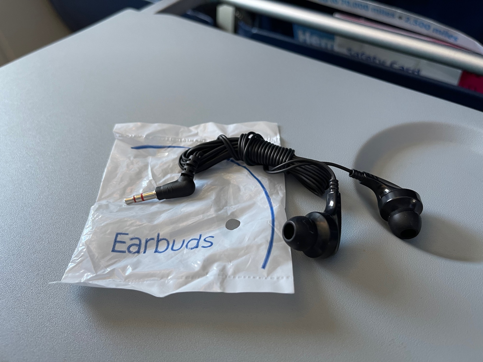 a black earbuds on a white package