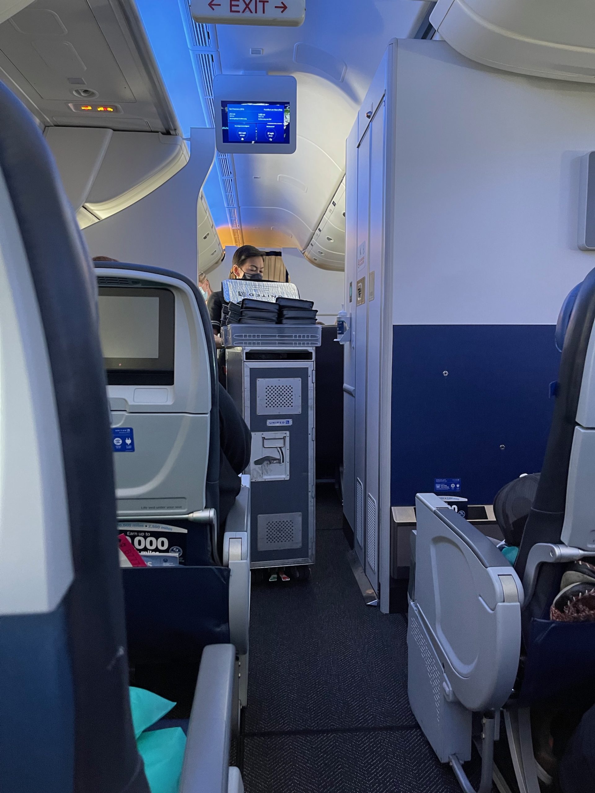 a person sitting on a chair in an airplane