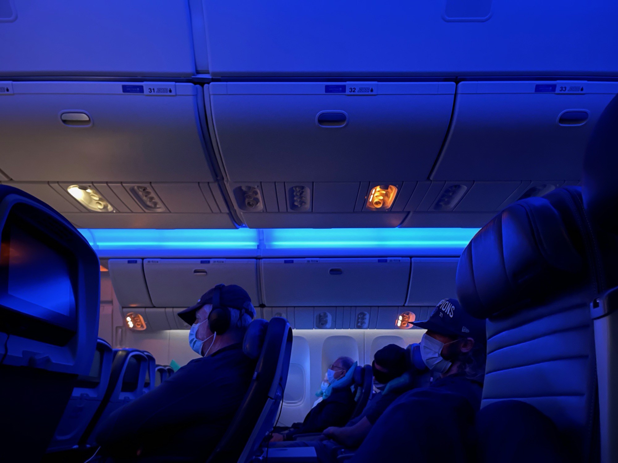 people in a plane with a mask on