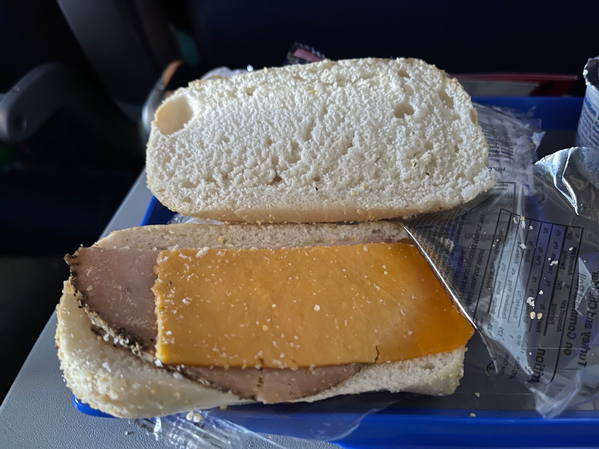 a sandwich with a knife on a tray
