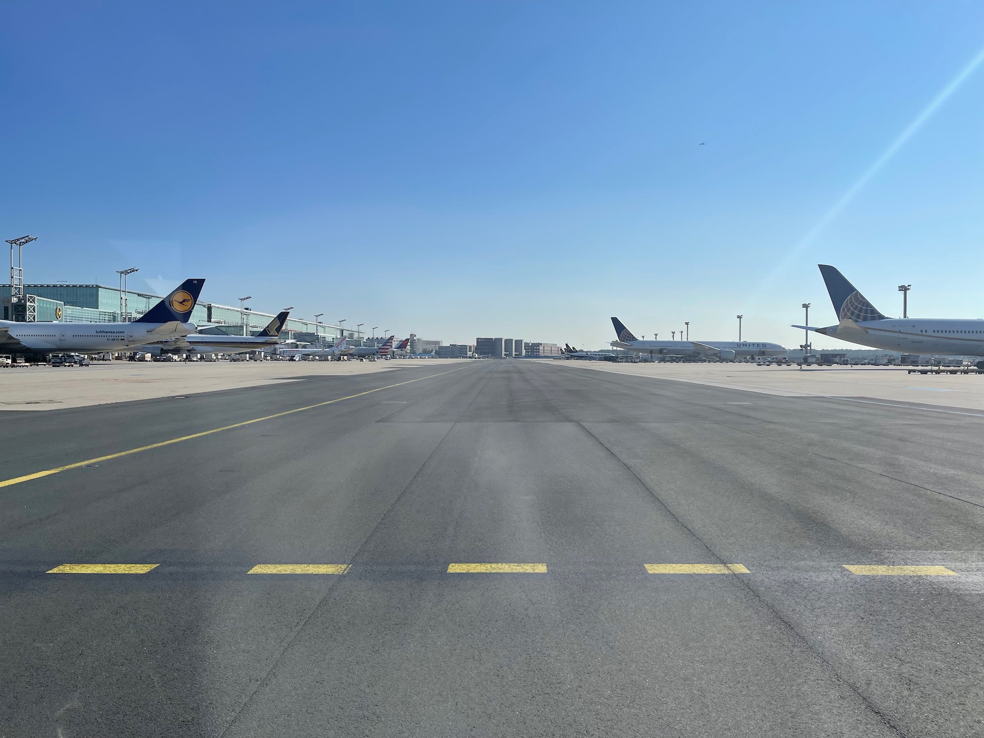 a group of airplanes on a runway