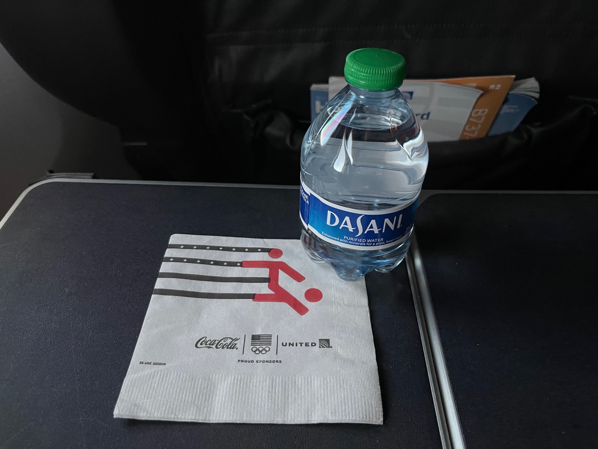 a bottle of water on a napkin