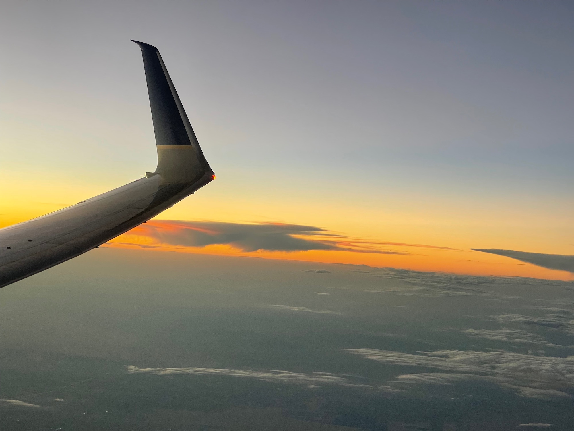 an airplane wing in the sky