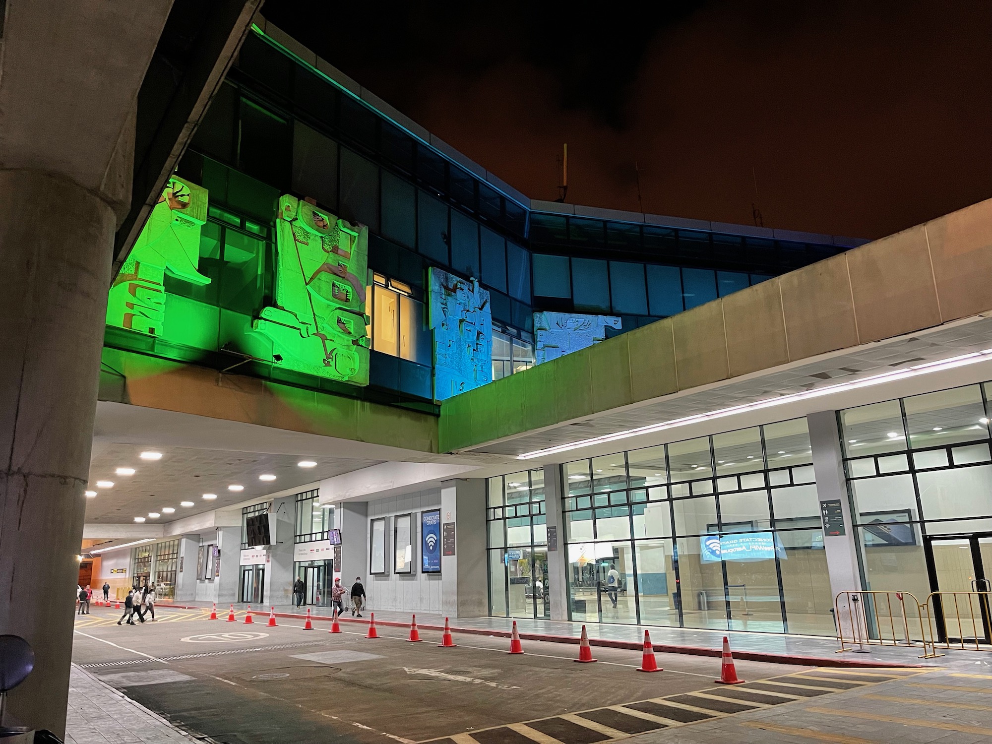 a building with a green light on the side