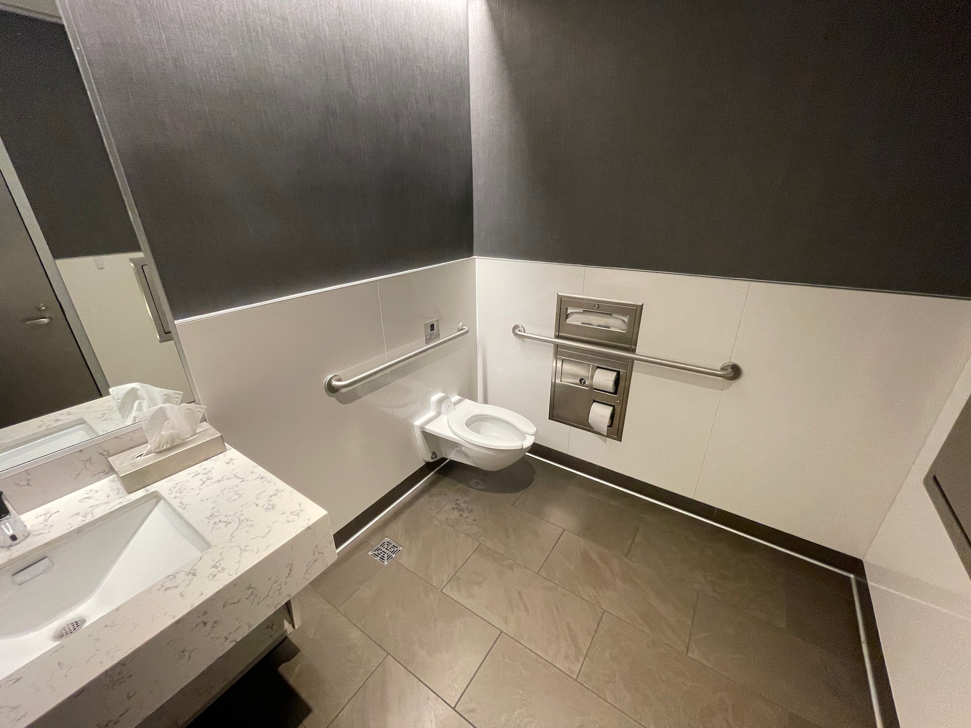 a bathroom with a toilet and sink