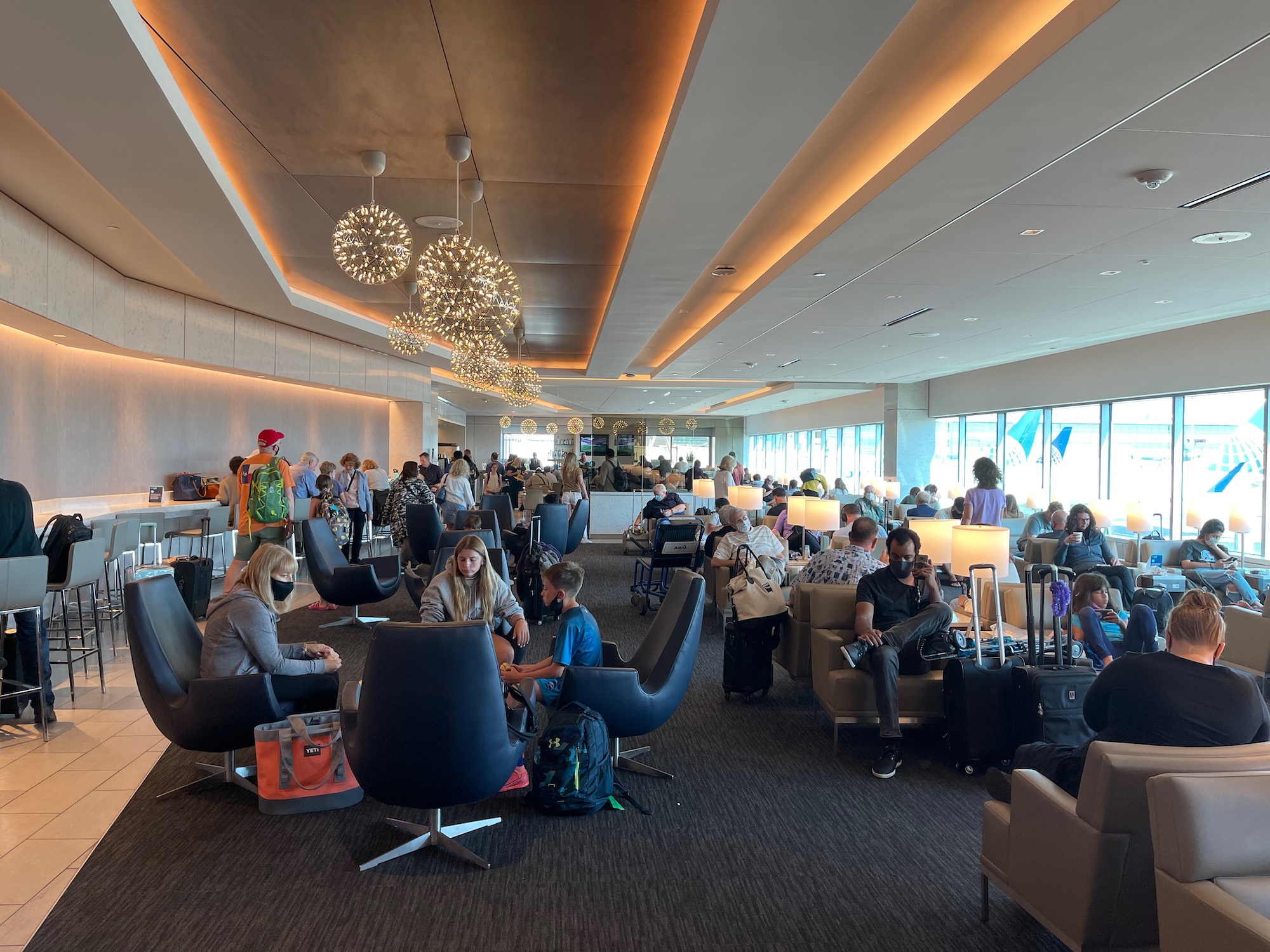 a group of people sitting in a lounge area