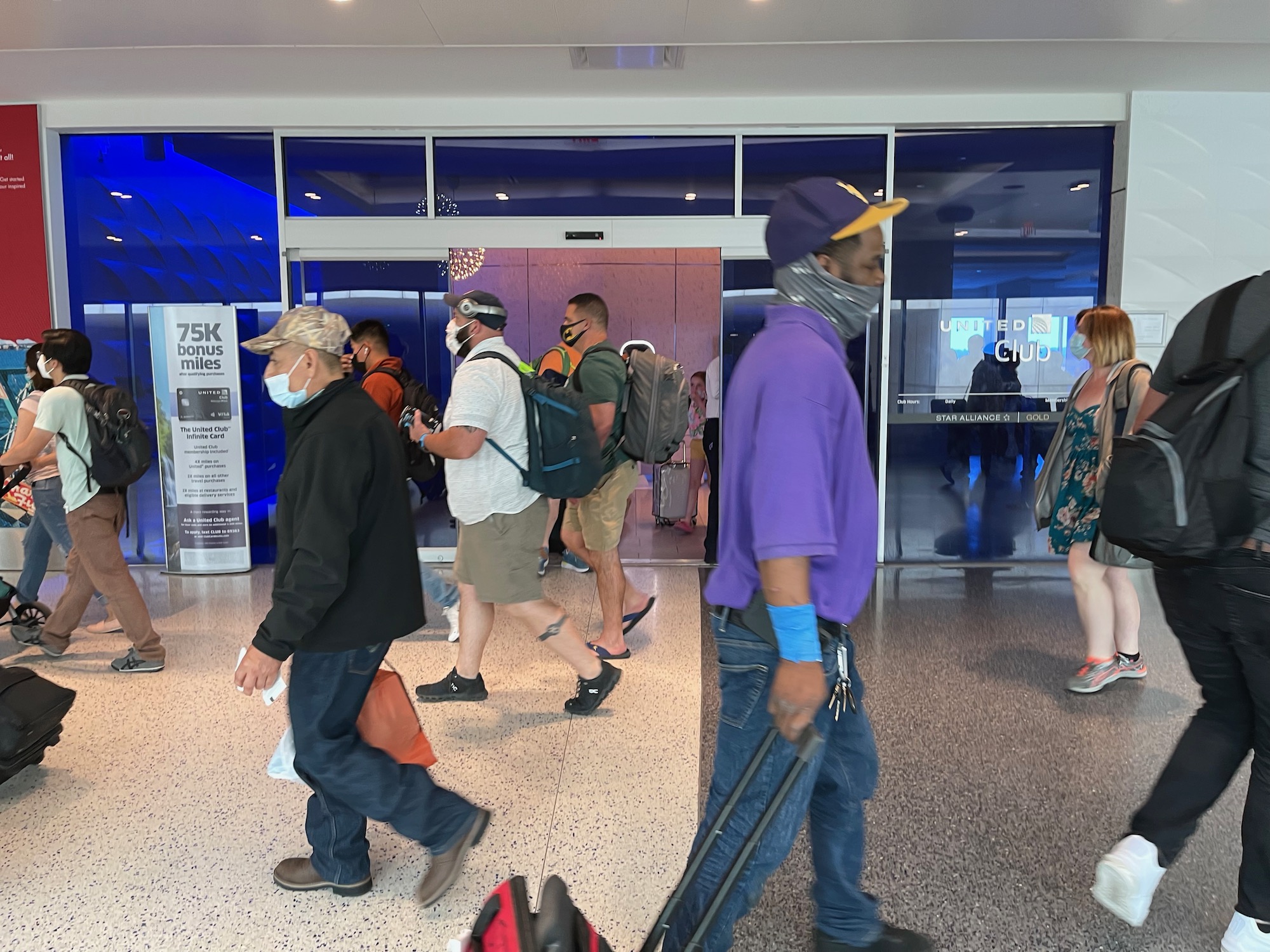 a group of people walking in a building