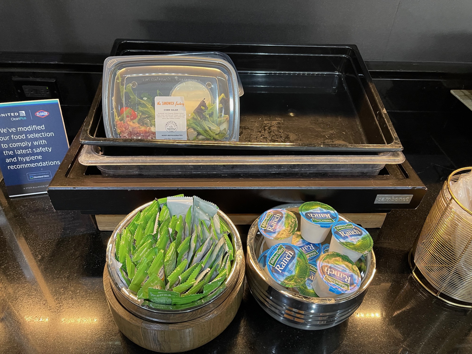 food in a container and bowls of food