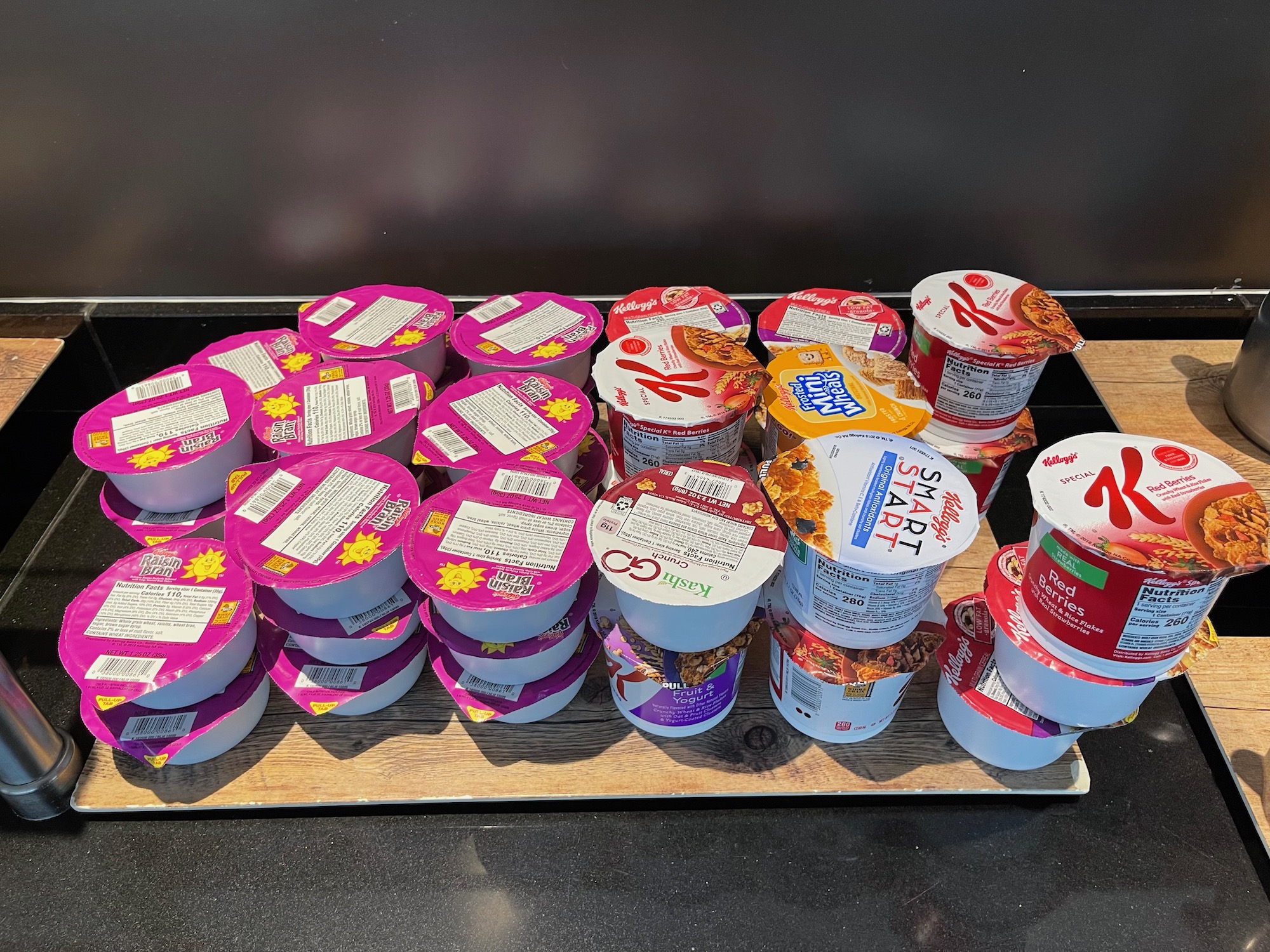 a group of yogurt containers on a wooden surface