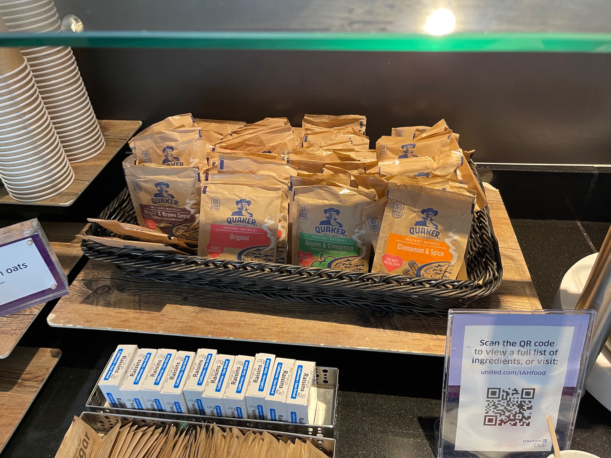 a tray of brown bags on a wood surface