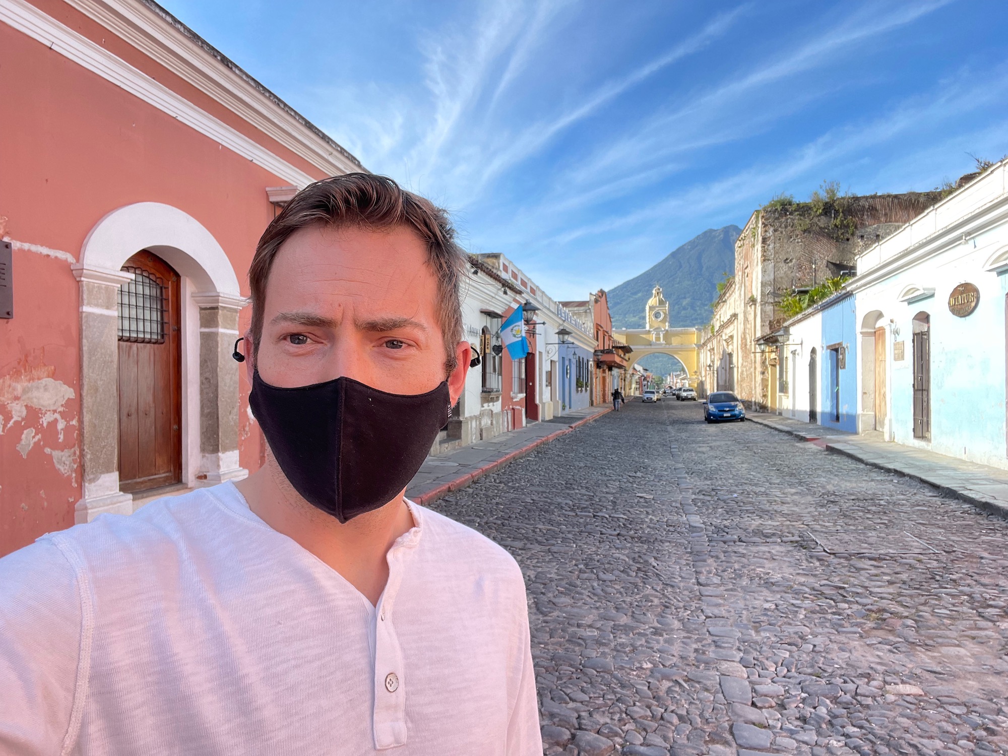 a man wearing a face mask on a street