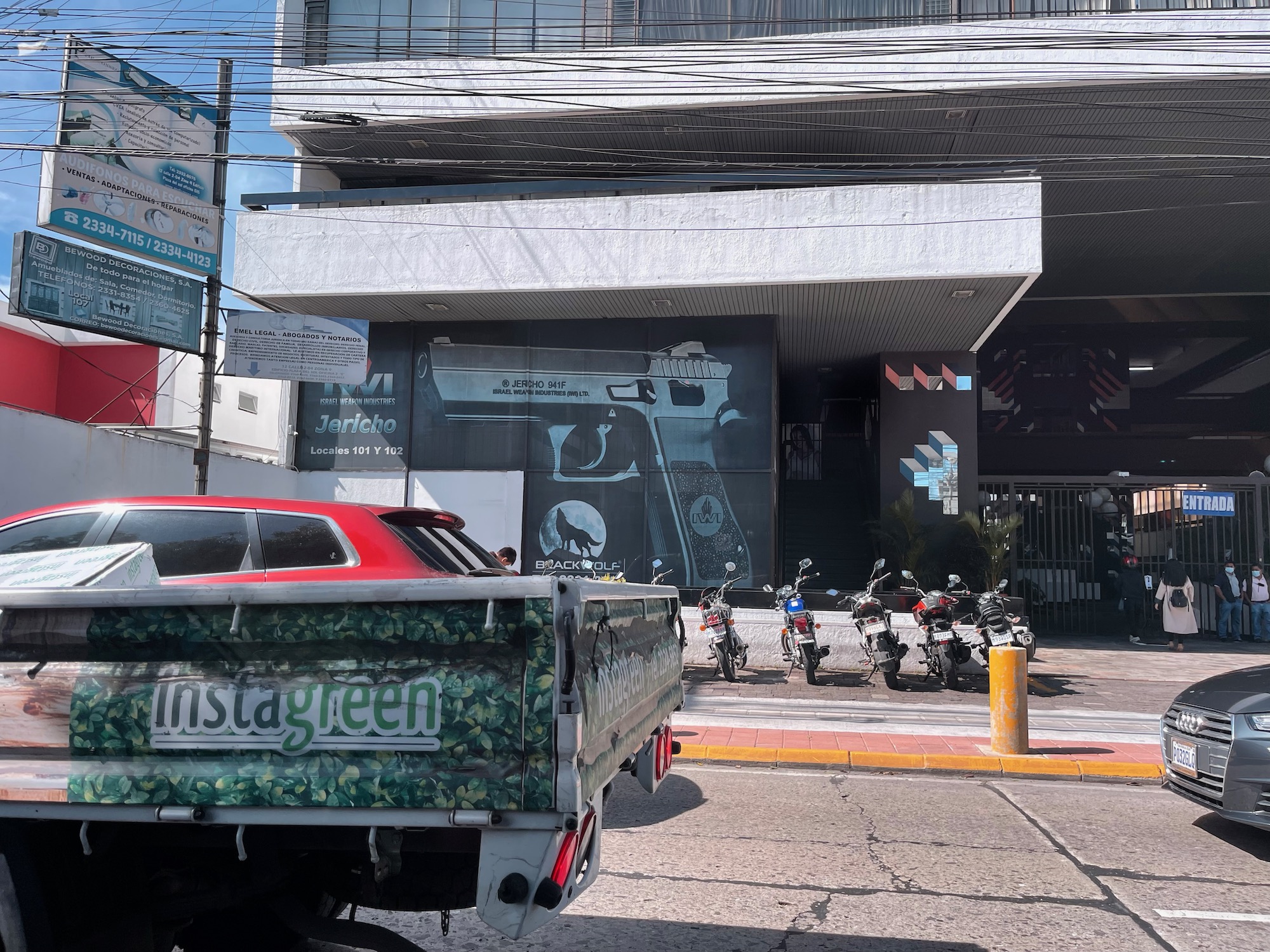 a red truck parked on the side of a road