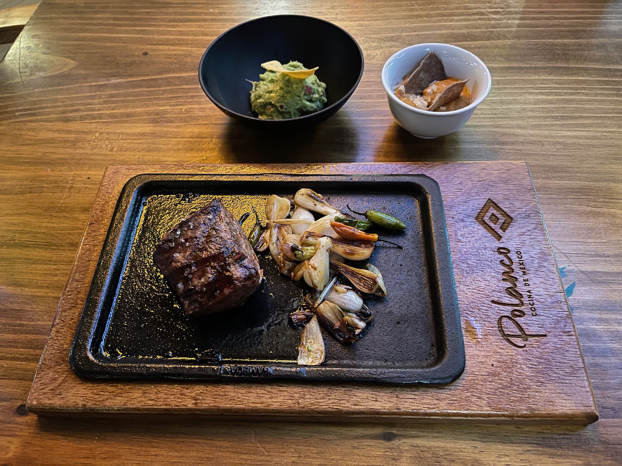 a plate of food on a wood surface