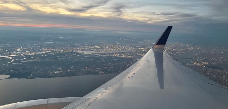 an airplane wing in the sky