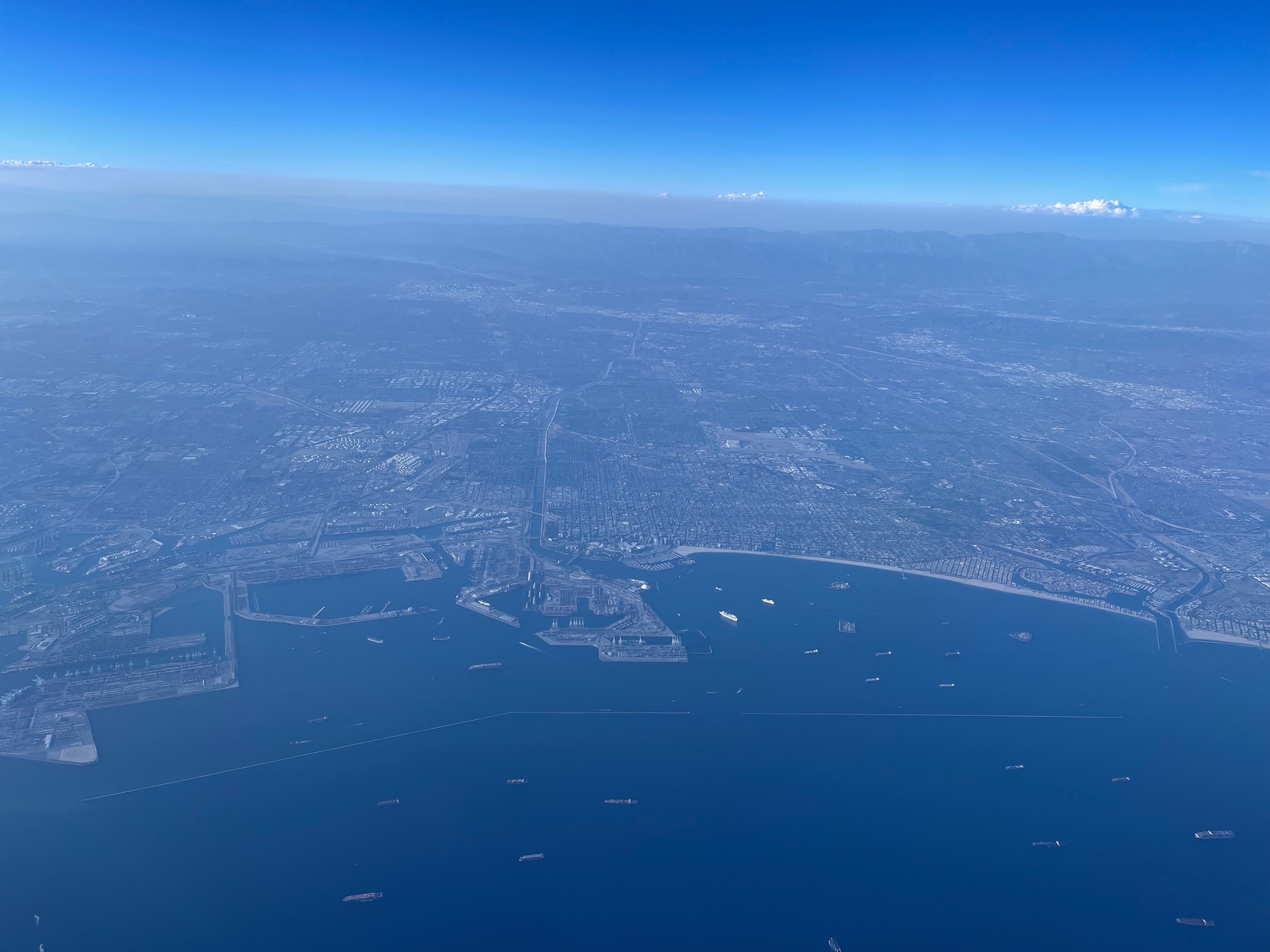 an aerial view of a city and water