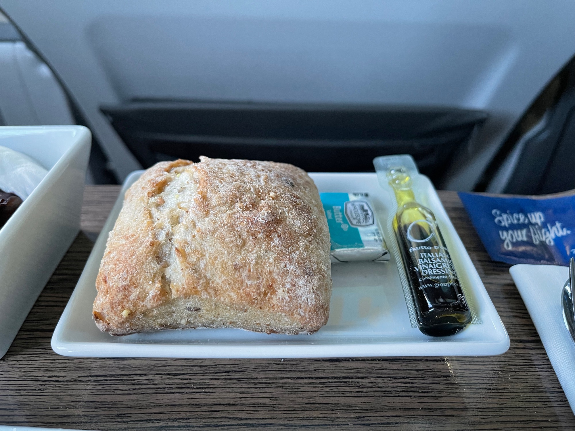 a plate of food and a bottle of oil