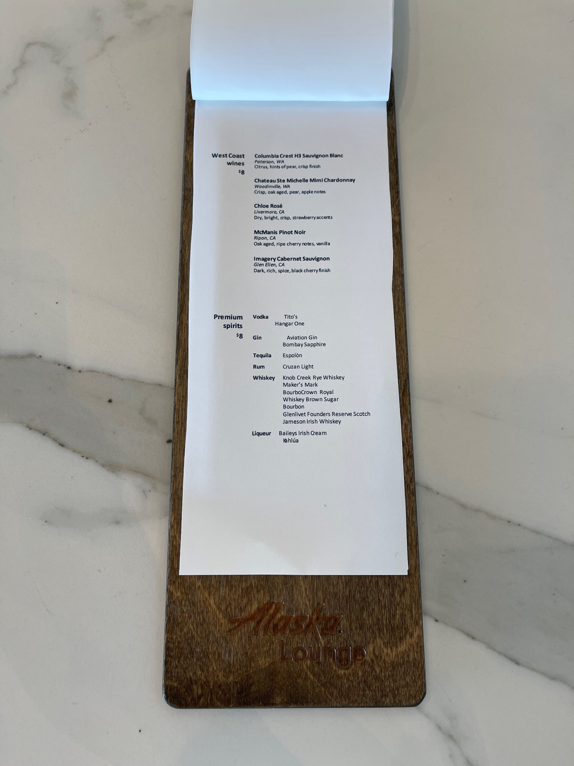 a menu on a wood stand