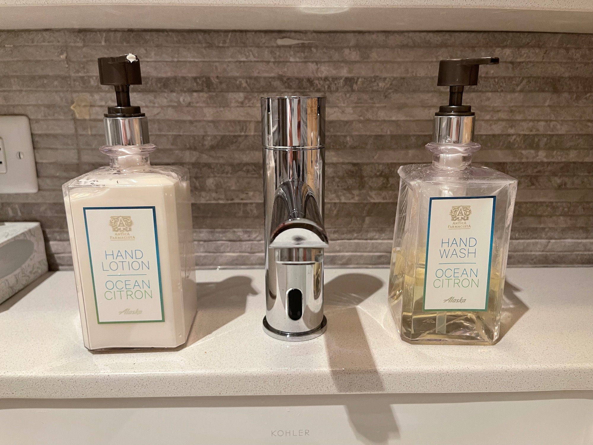 a group of soap dispensers on a counter