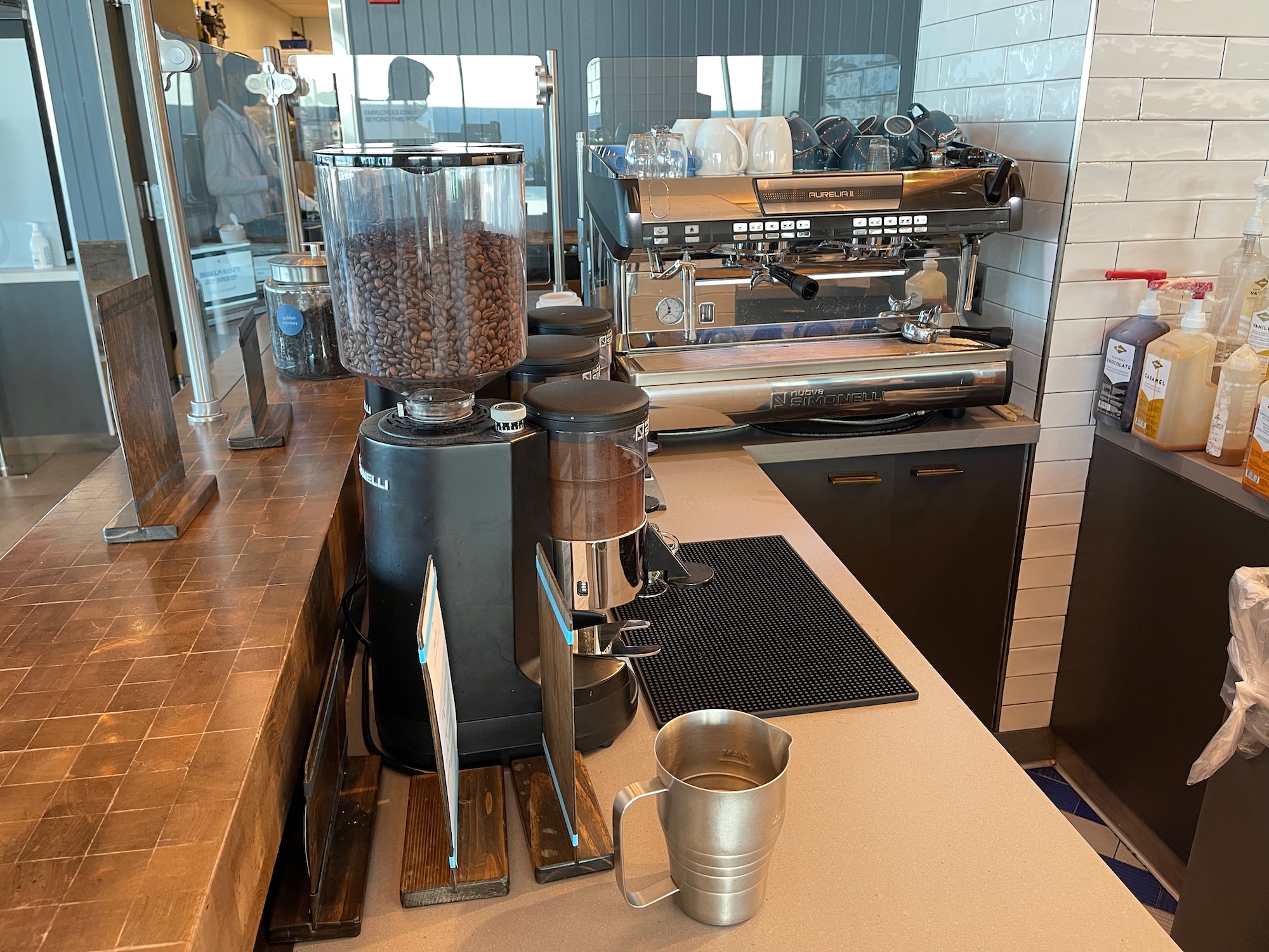 a coffee machine and a cup on a counter