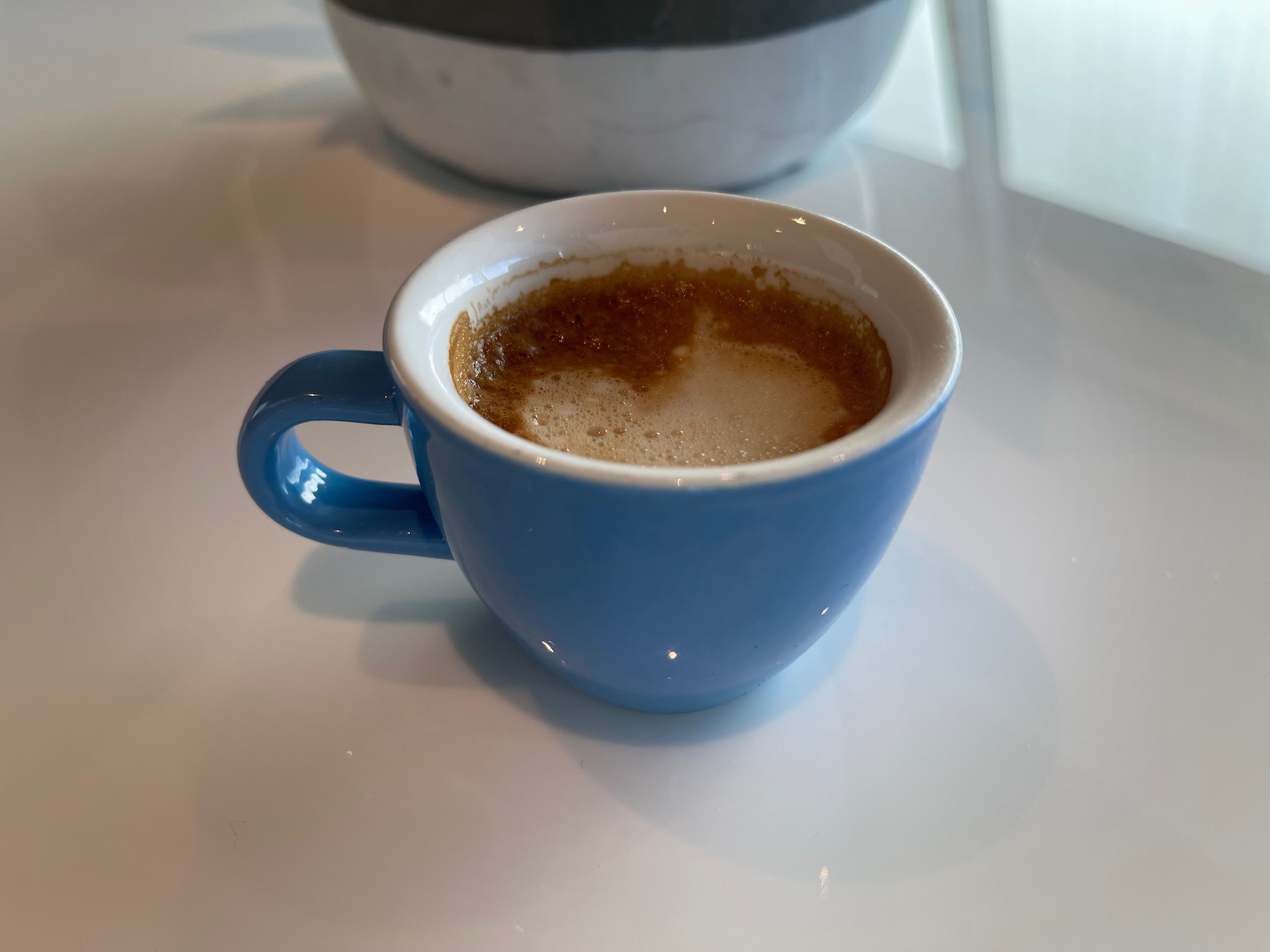 a blue cup of coffee