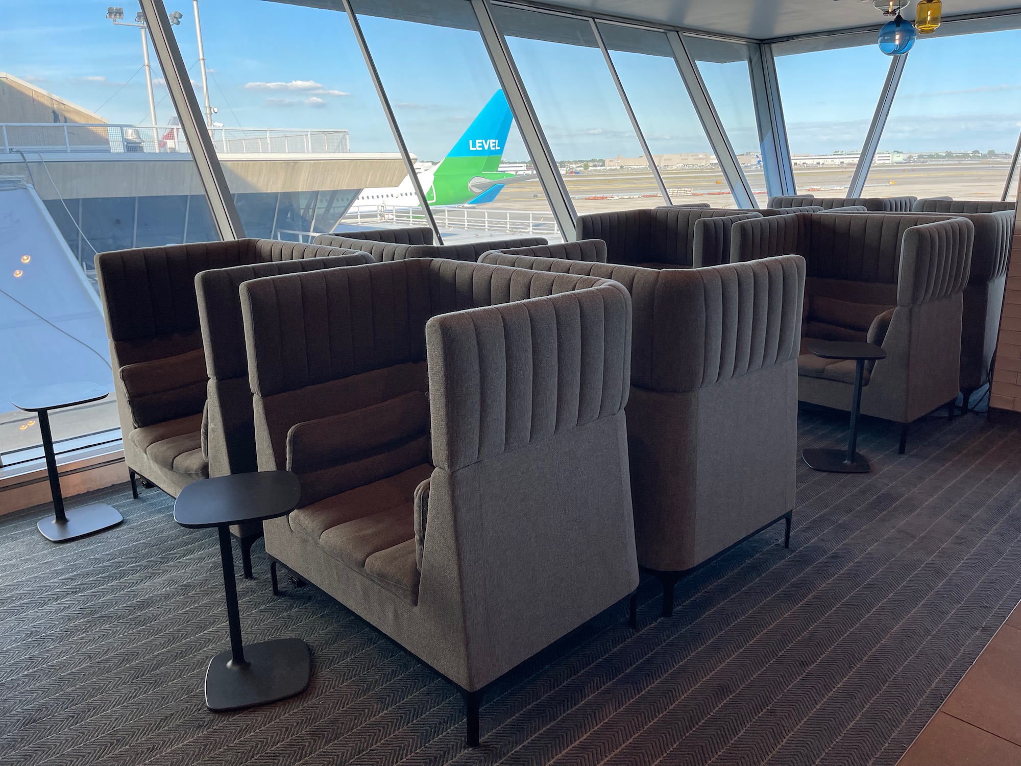 a group of chairs in a room with windows