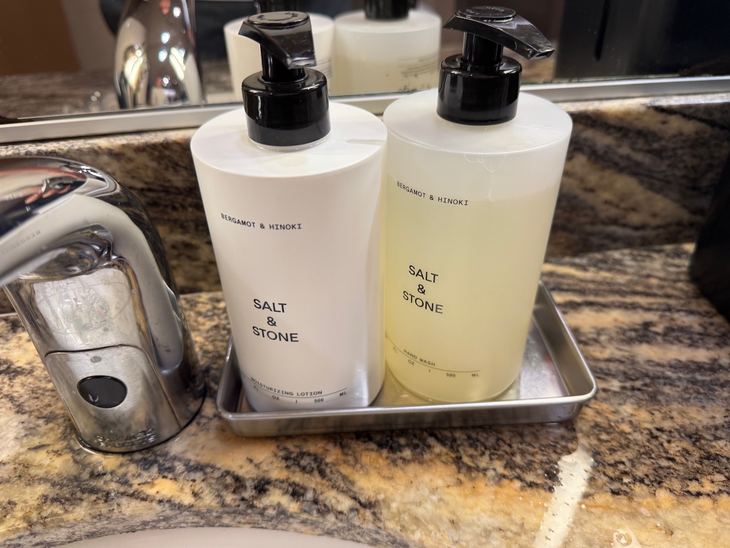 a group of bottles of liquid on a tray