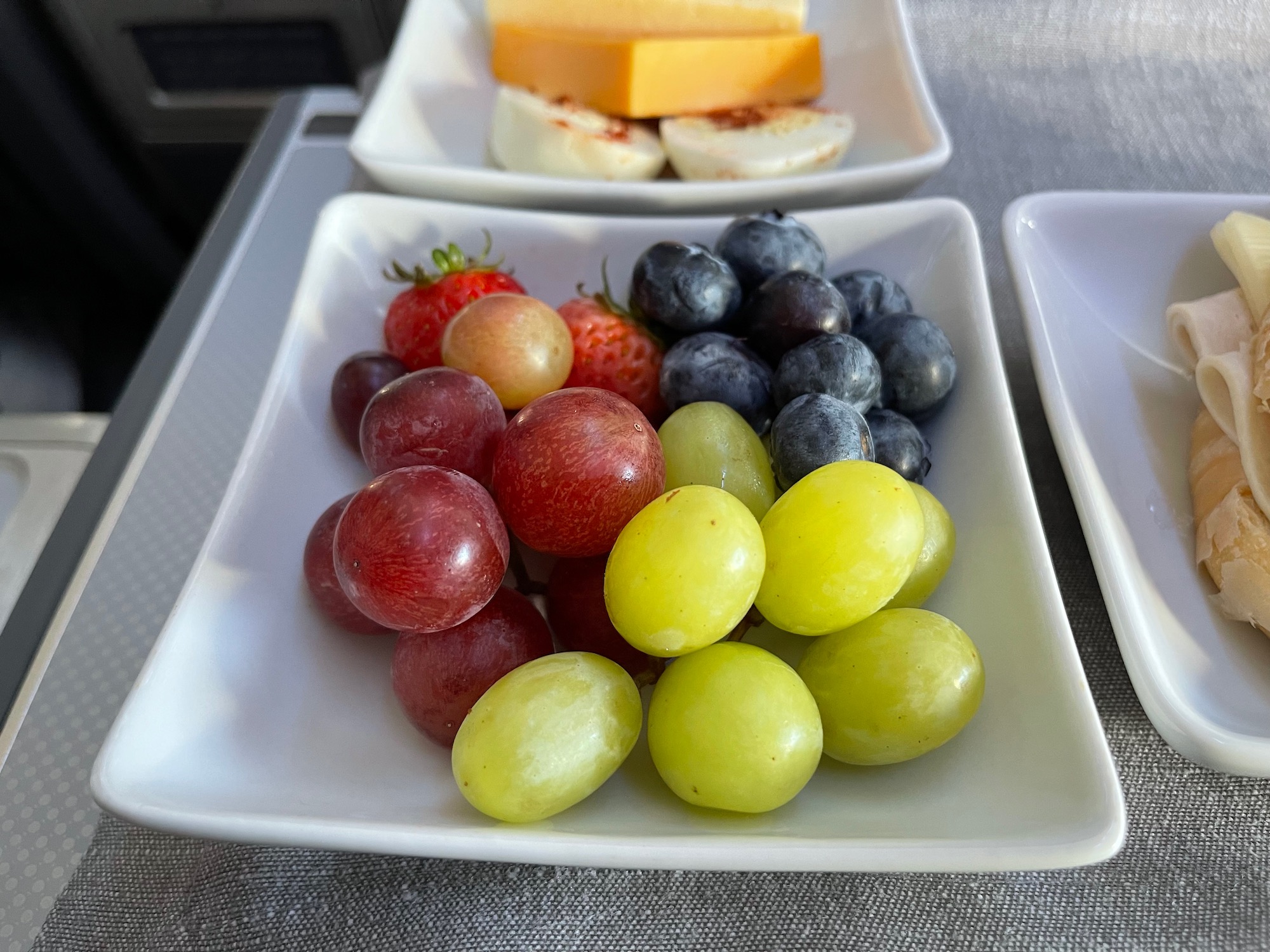 a plate of fruit on a tray