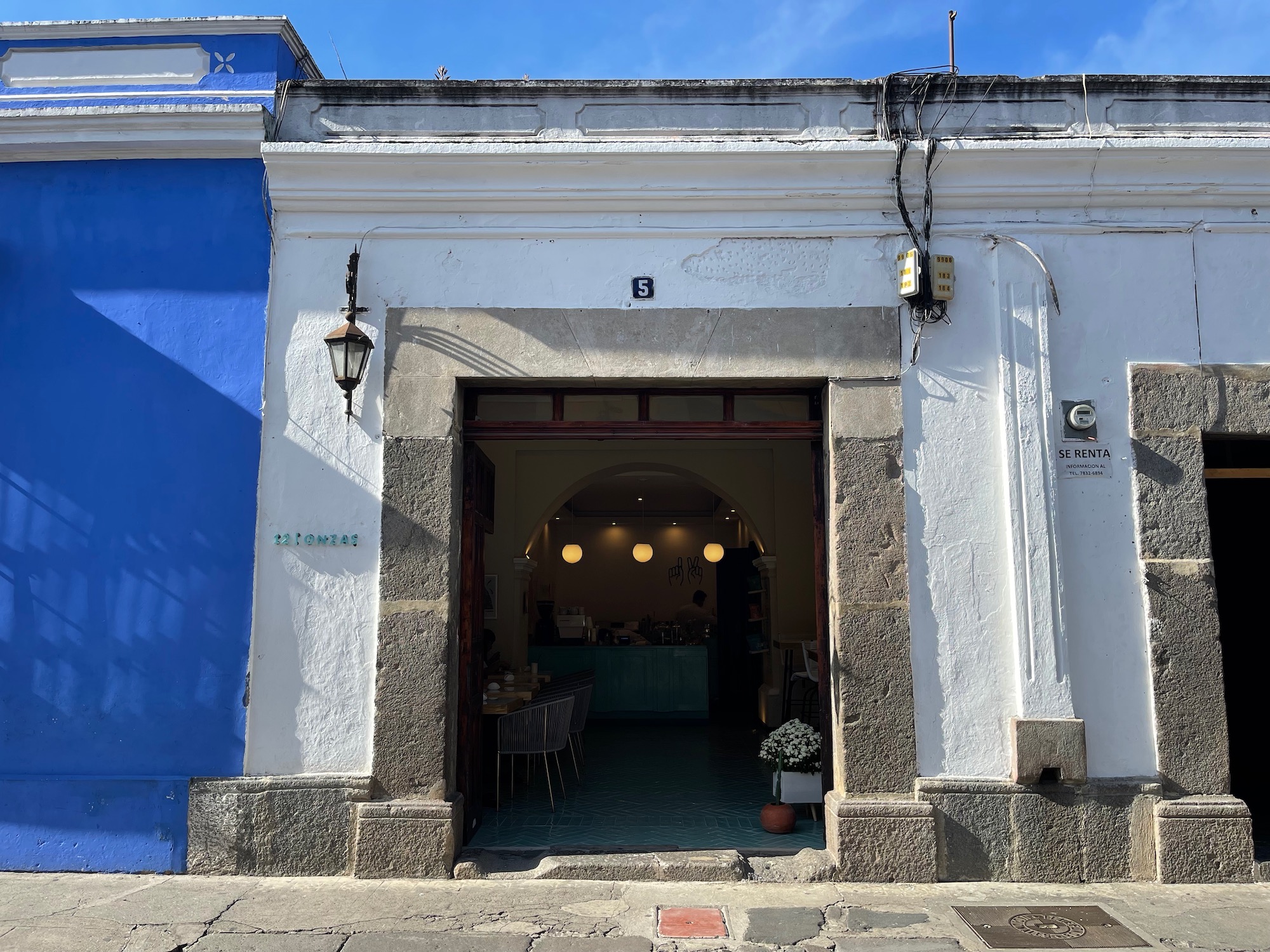 a building with a blue wall and a white wall