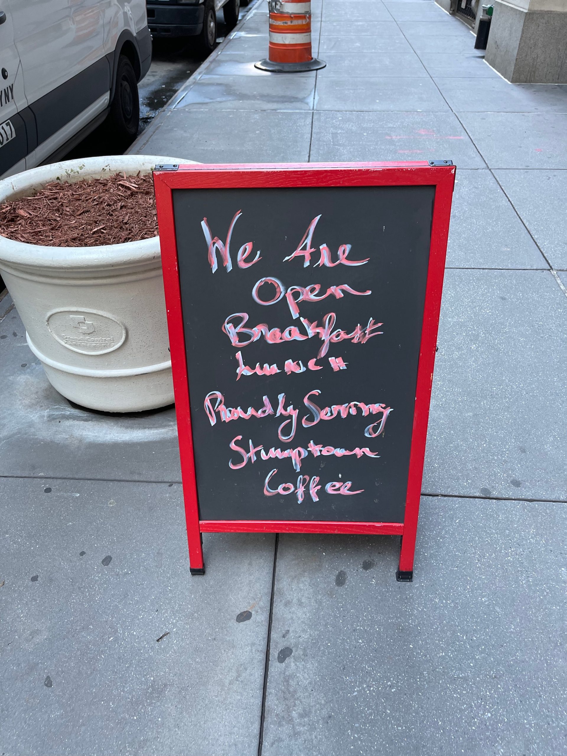 a sign on the sidewalk