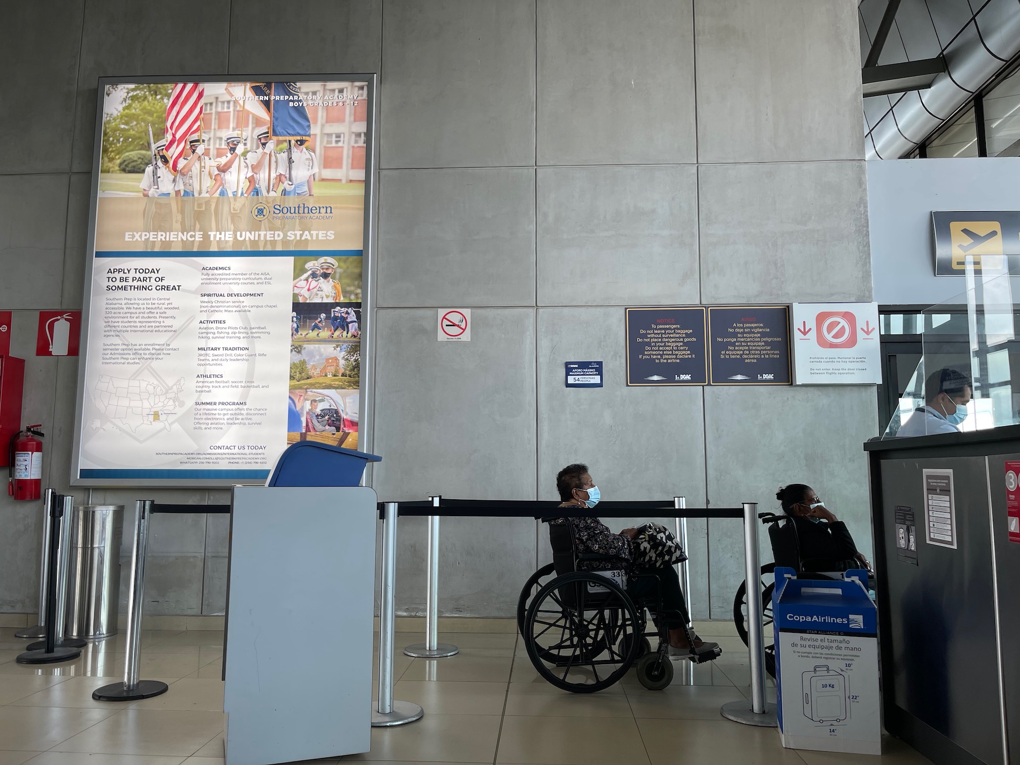 a person in a wheelchair in a waiting area