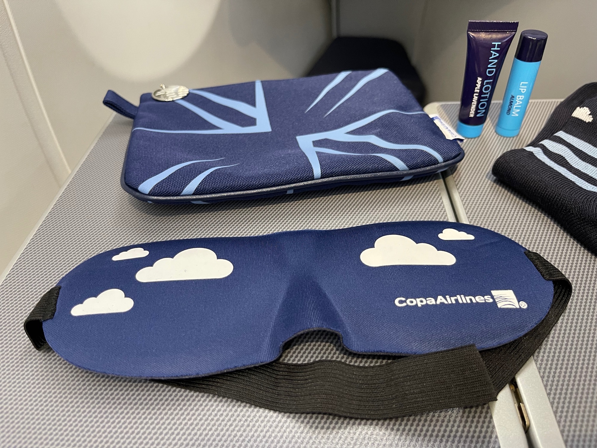 a blue eye mask and a blue case on a table