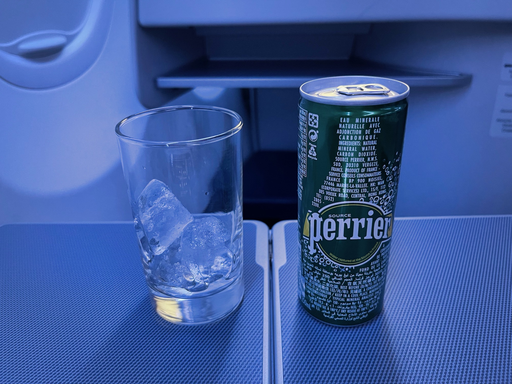 a can and glass on a table