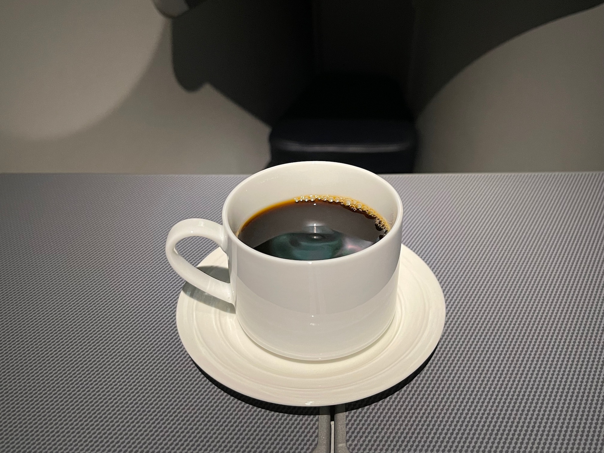 a cup of coffee on a saucer