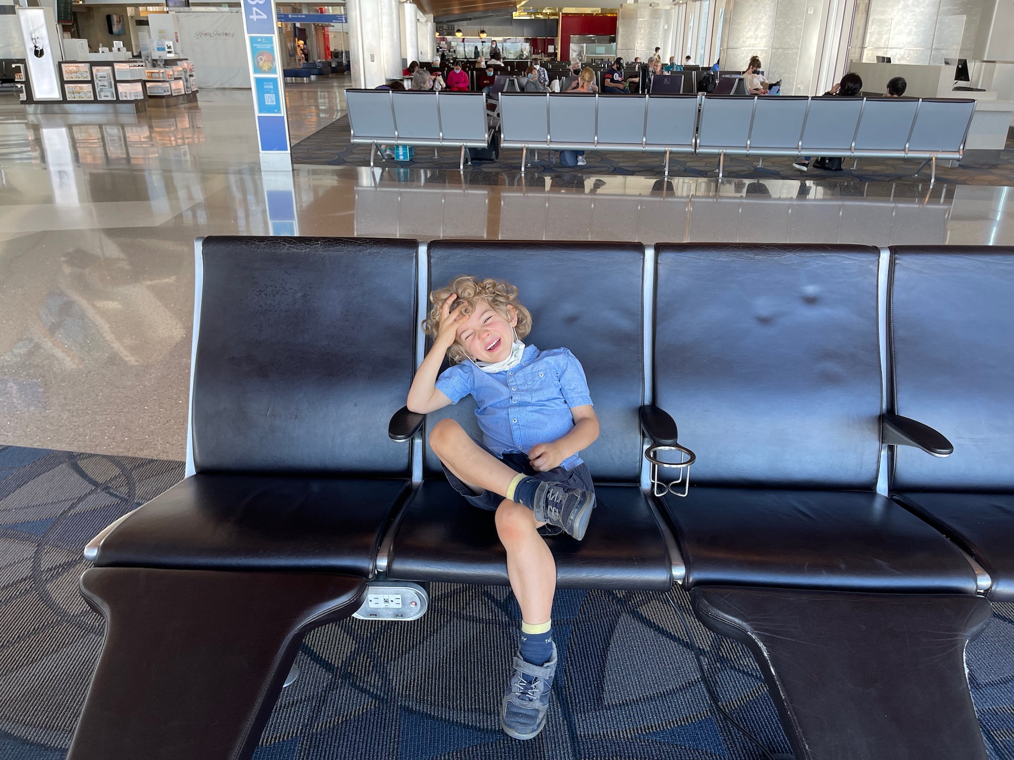 a boy sitting on a bench