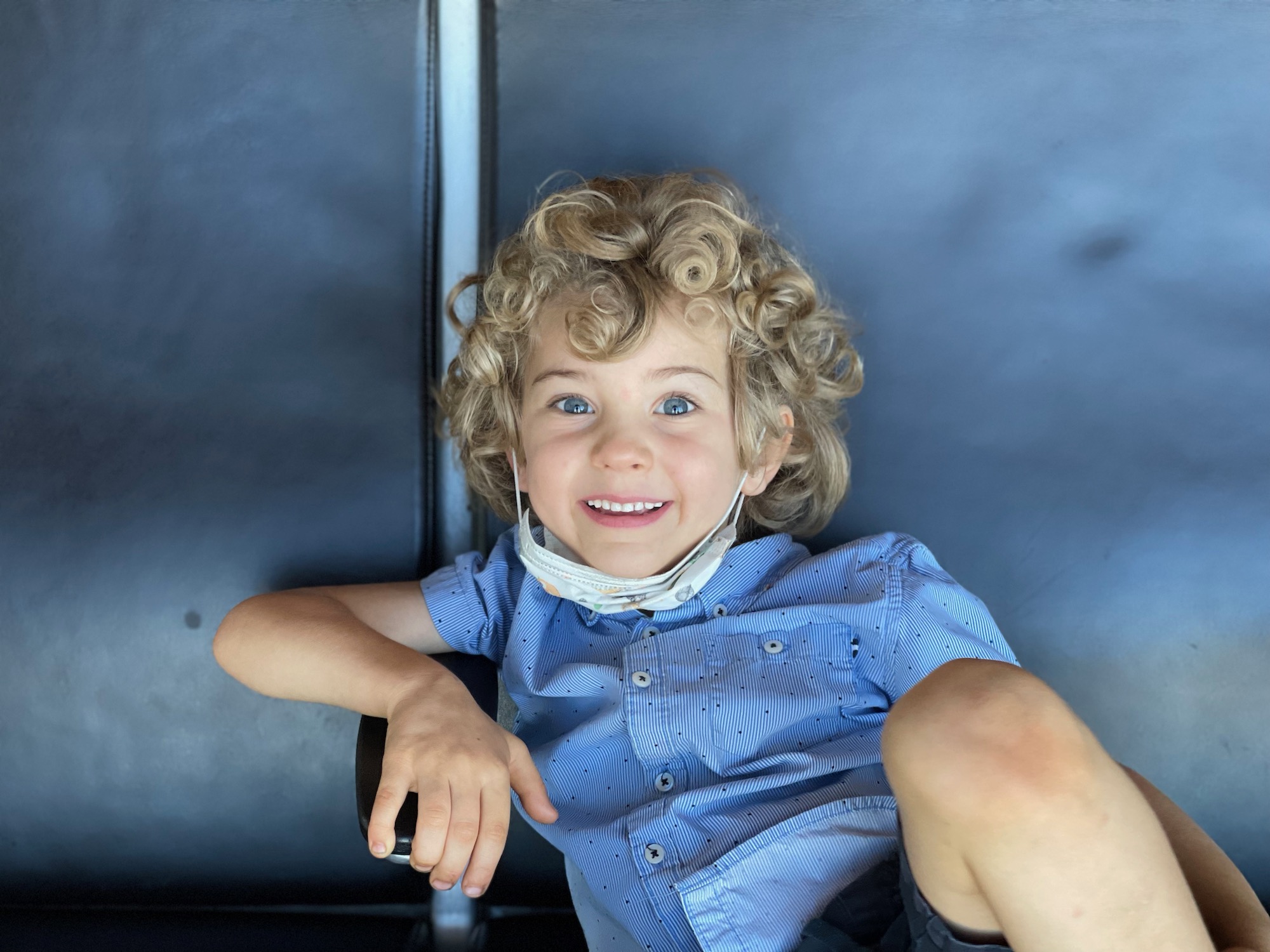 a boy sitting in a chair