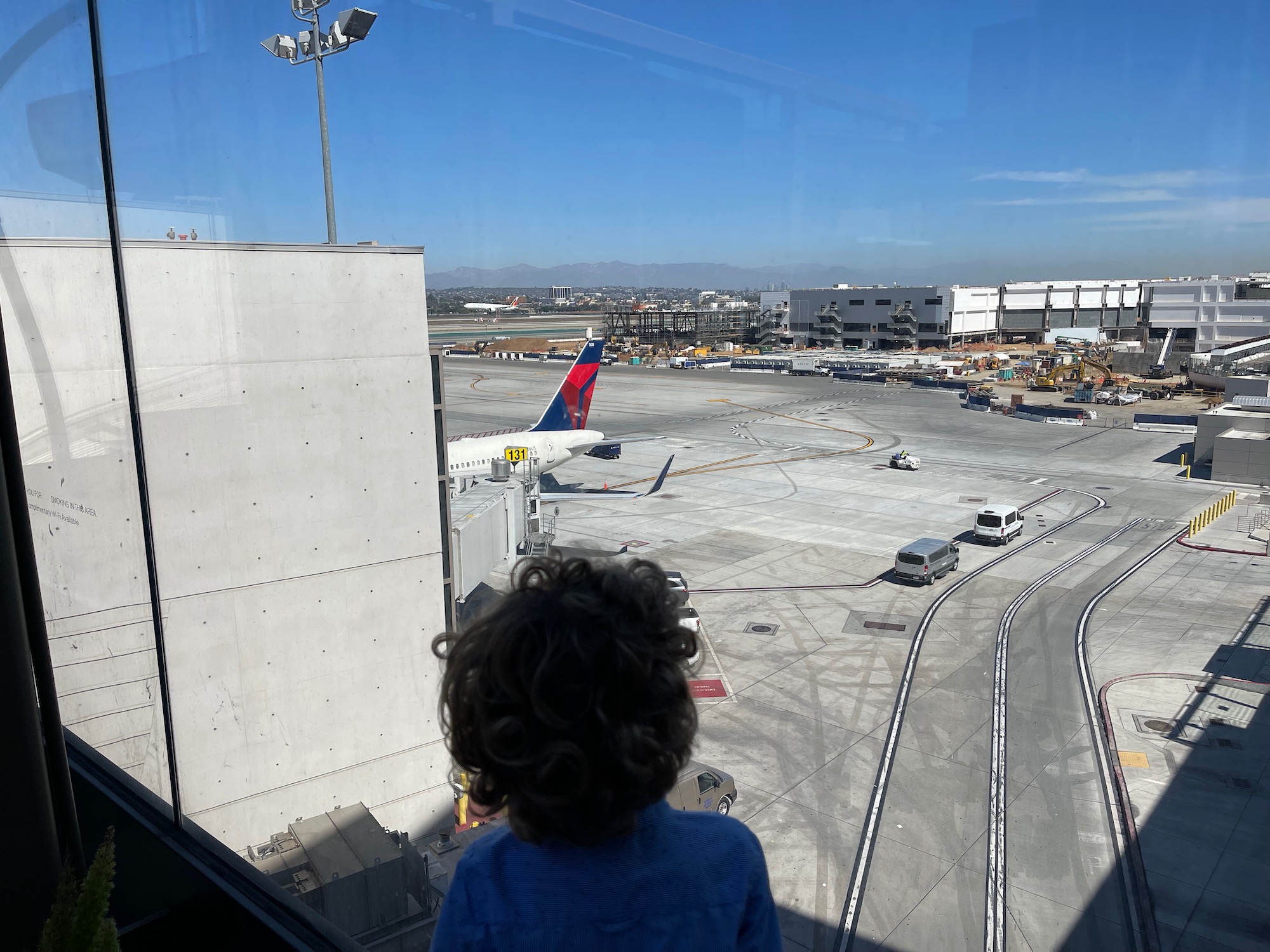 a child looking at an airport