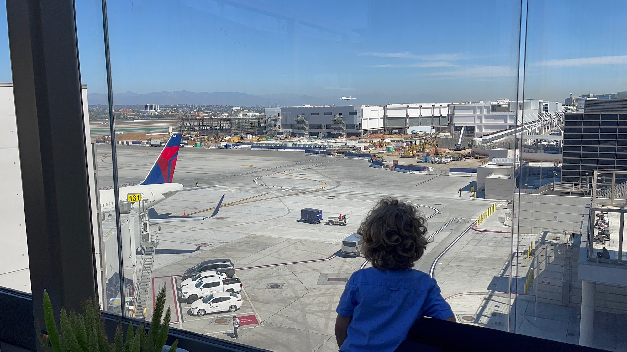 a child looking at an airport