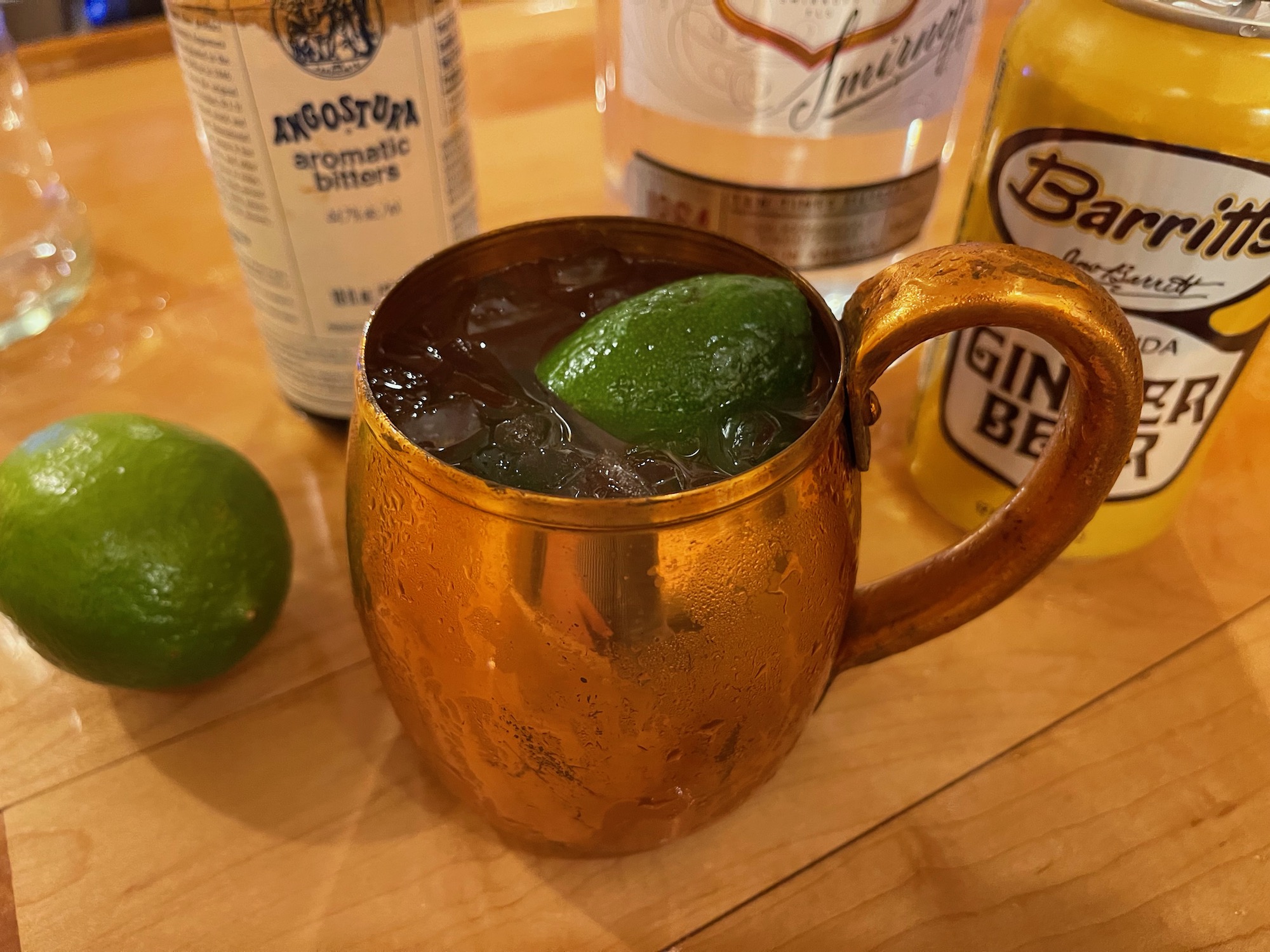 a copper mug with a lime wedge in it