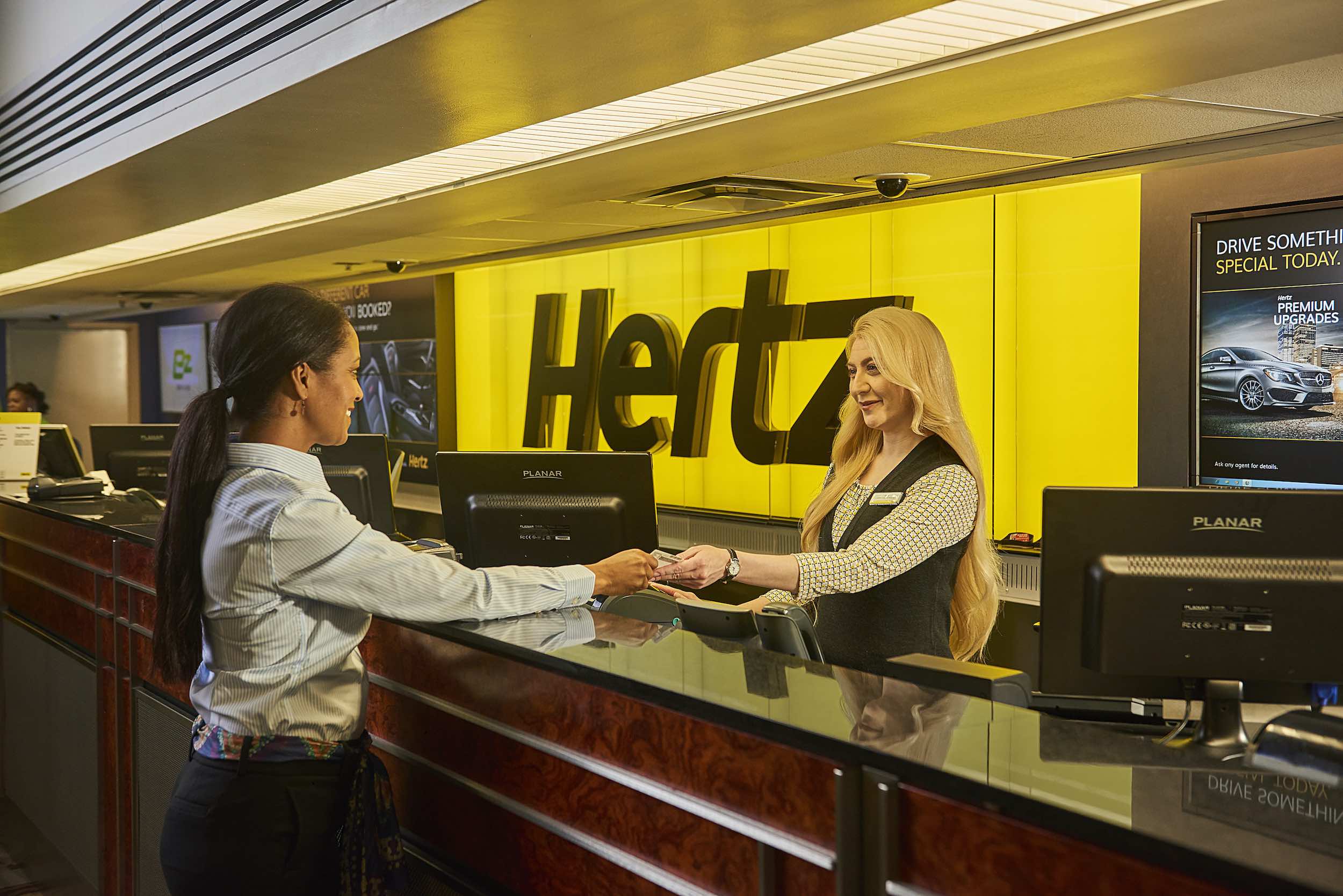 a woman shaking hands with a customer