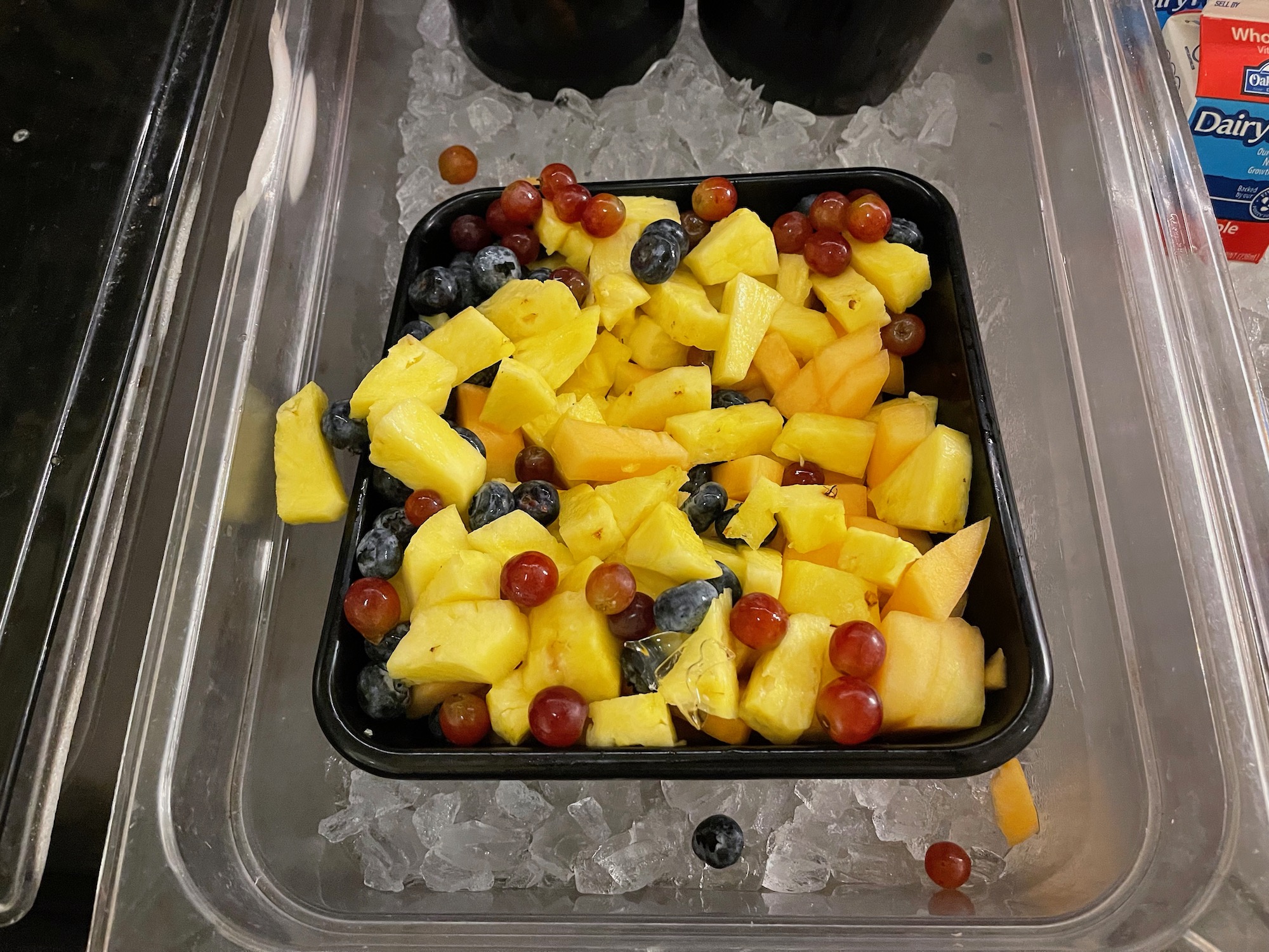 a bowl of fruit on ice
