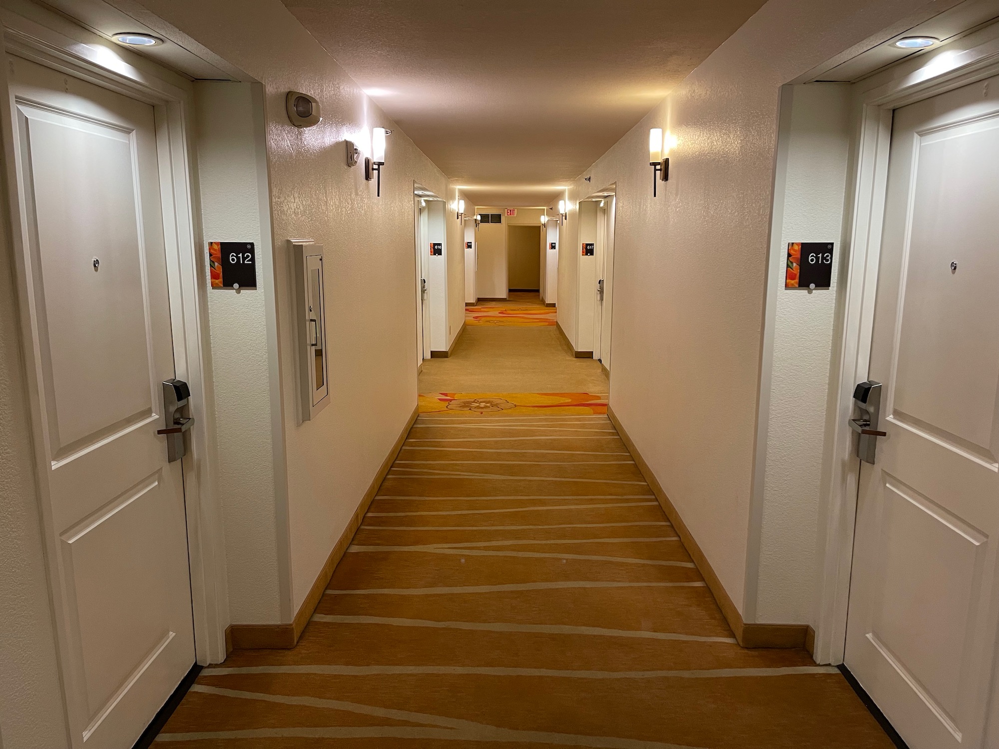 a hallway with doors and lights