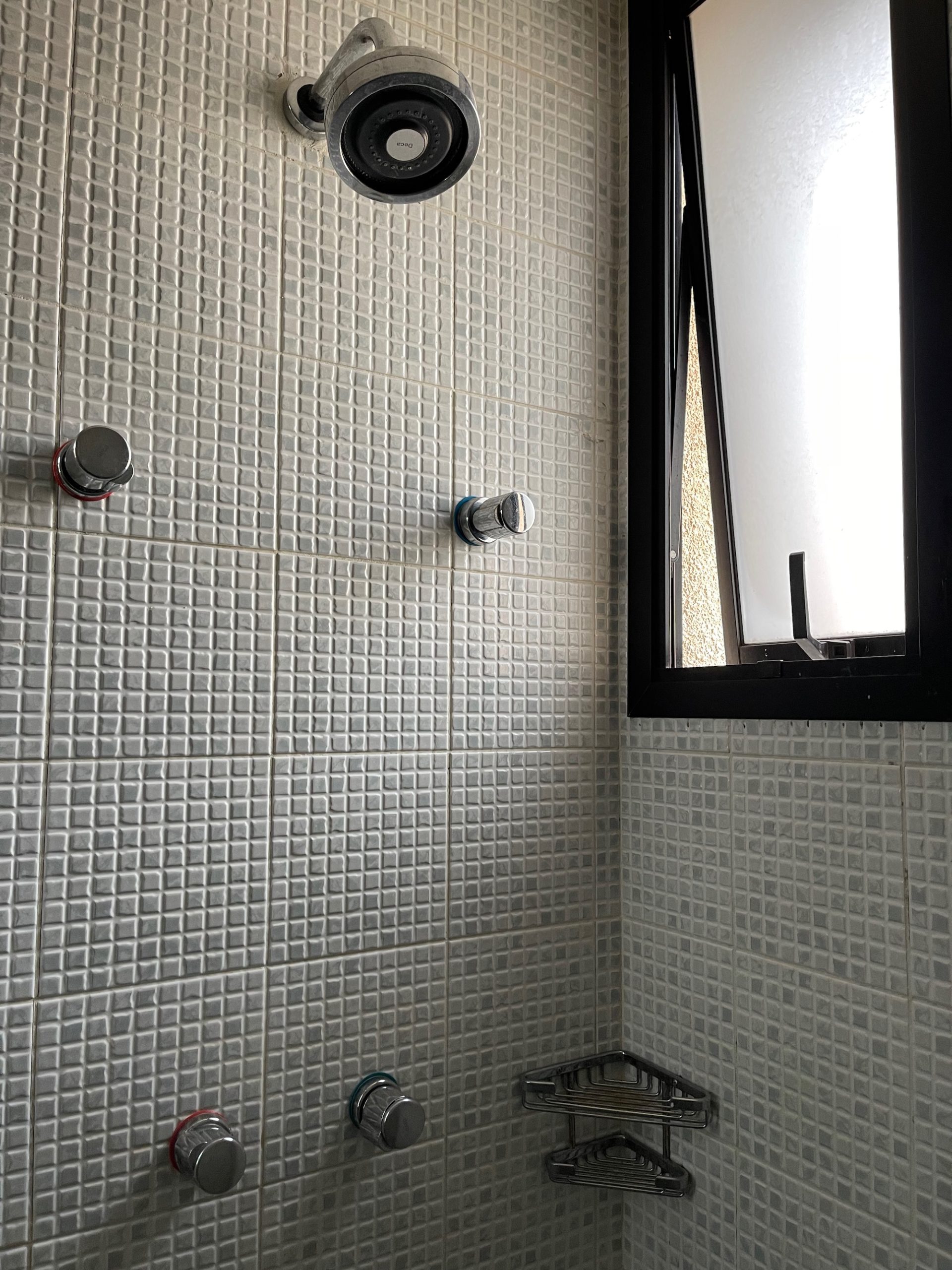 a shower with a shower head and shower head